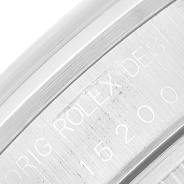 This image shows a close-up of the engraving on the side of a Rolex Date 15200 Men's Stainless Steel White Dial 15200 Men's Stainless Steel White Dial model watch case, displaying its serial number.
