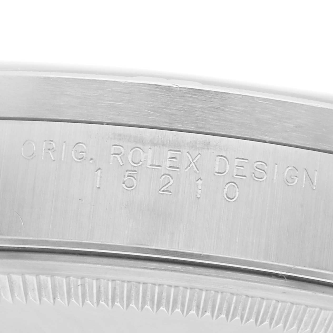 The image shows a close-up of the edge of the case back, highlighting the engraved model number of the Rolex Date 15210 Men
s Stainless Steel Silver Dial watch.