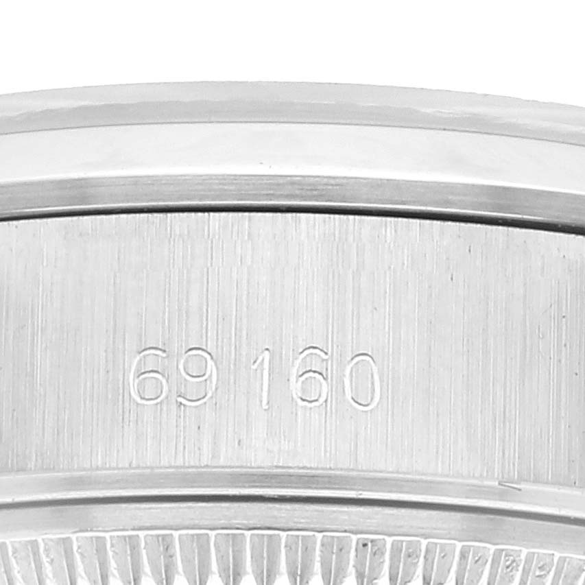 This image shows the reference number 69160 on the side case of a Rolex Date 69160 Women
s Stainless Steel Silver Dial 69160 Women
s Stainless Steel Silver Dial watch.