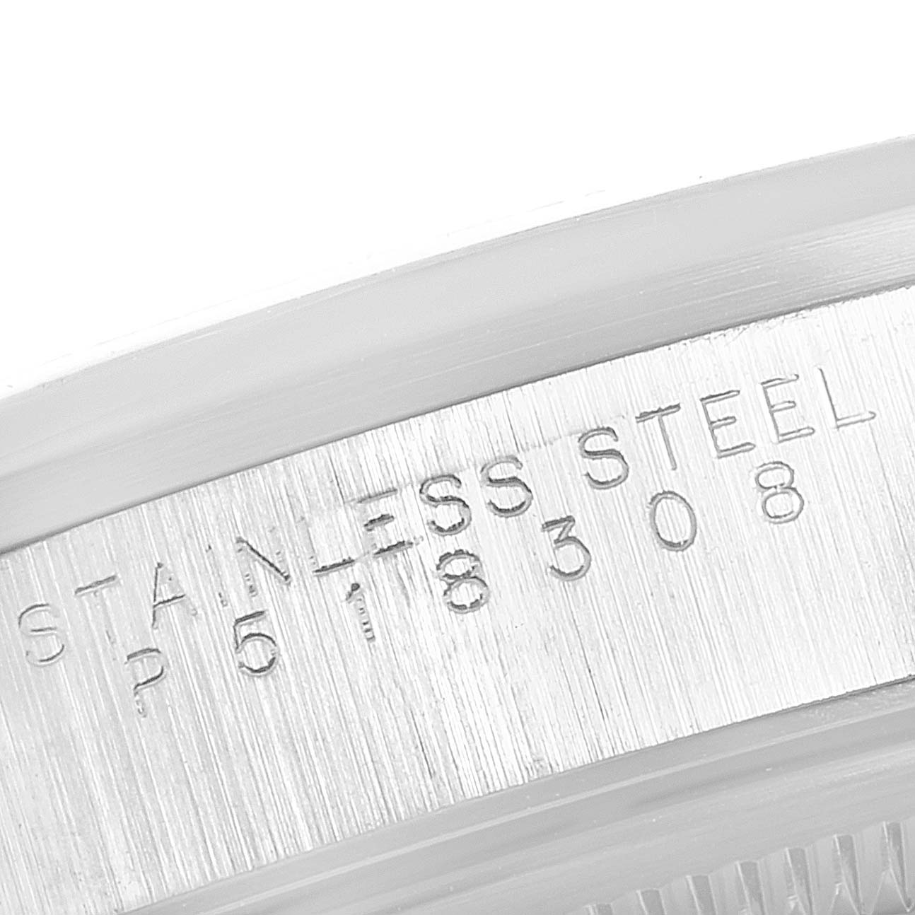 The image shows a close-up view of the serial number engraved on the case back of a stainless steel Rolex Date 15200 Men's Stainless Steel Silver Dial 15200 Men's Stainless Steel Silver Dial watch.