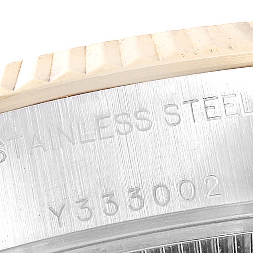 Close-up view showing the stainless steel case and serial number engraving of a Rolex Datejust 79173 Women
s Steel and Gold (two tone) Champagne Dial 79173 Women
s Steel and Gold (two tone) Champagne Dial watch.