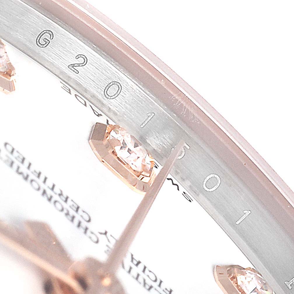 This image shows a close-up of the dial and markers of a Mid-Size Rolex watch.
