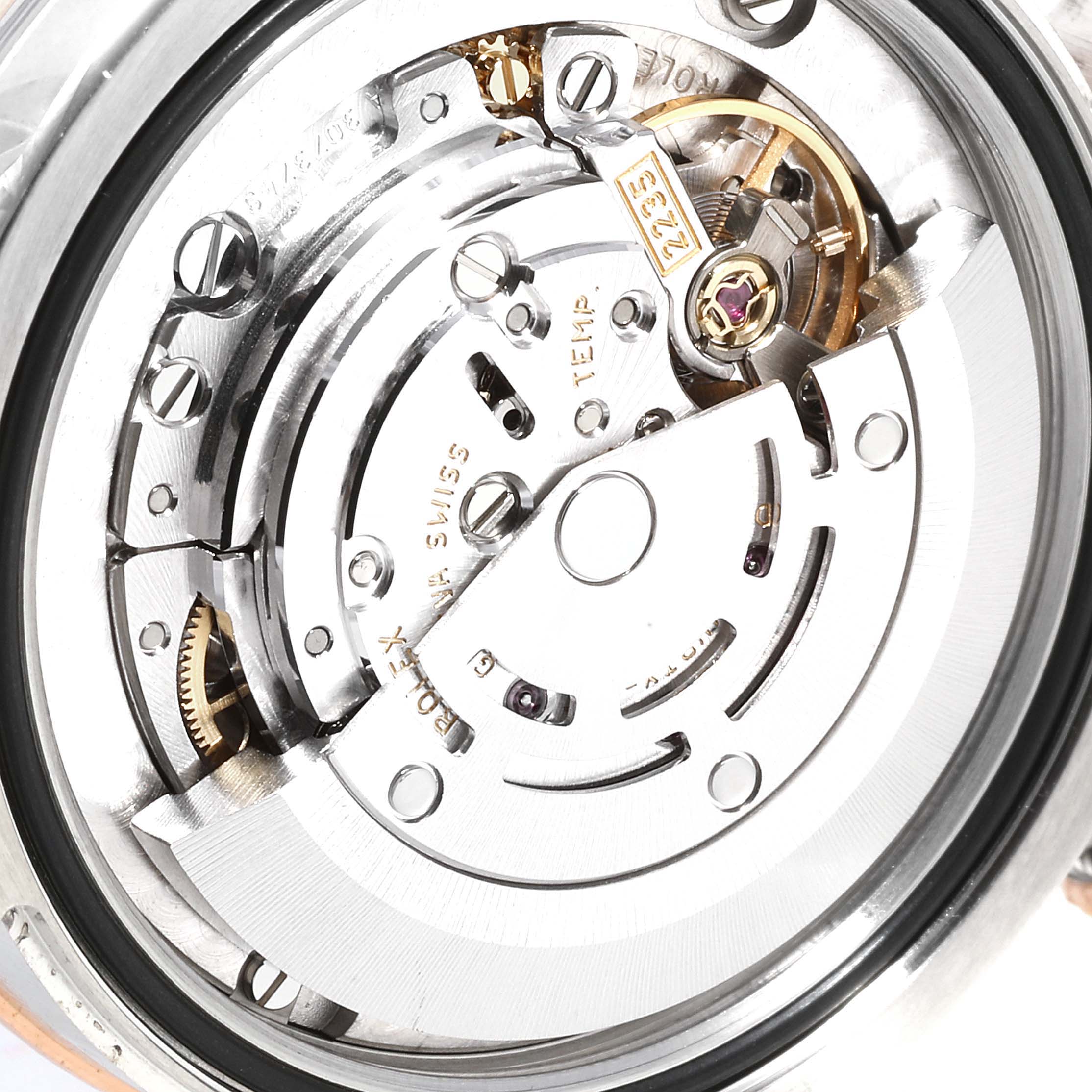 The image shows the internal mechanism and components of the mid-size Rolex watch
s movement from the back angle.