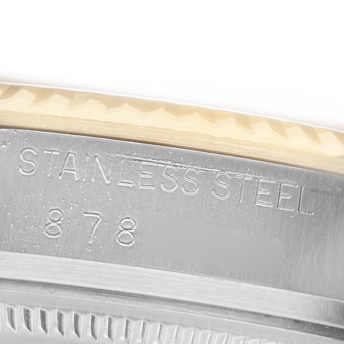 The image shows a close-up of the side case and bezel edge of a Rolex Datejust 16013 Men's Steel and Gold (two tone) Champagne Dial watch, highlighting the stainless steel engraving.
