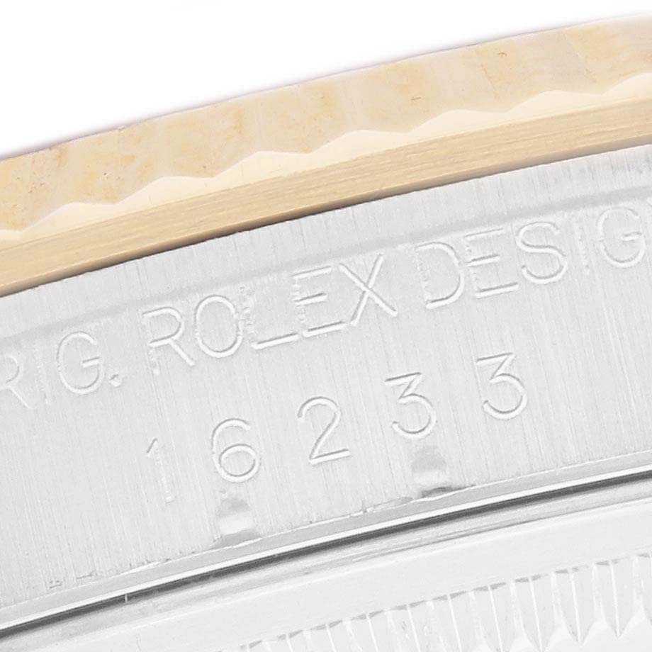 This image shows a close-up of the Rolex Datejust 16233 Men
s Steel and Gold (two tone) Yellow Dial 16233 Men
s Steel and Gold (two tone) Yellow Dial model
s rehaut or engraving on the case.