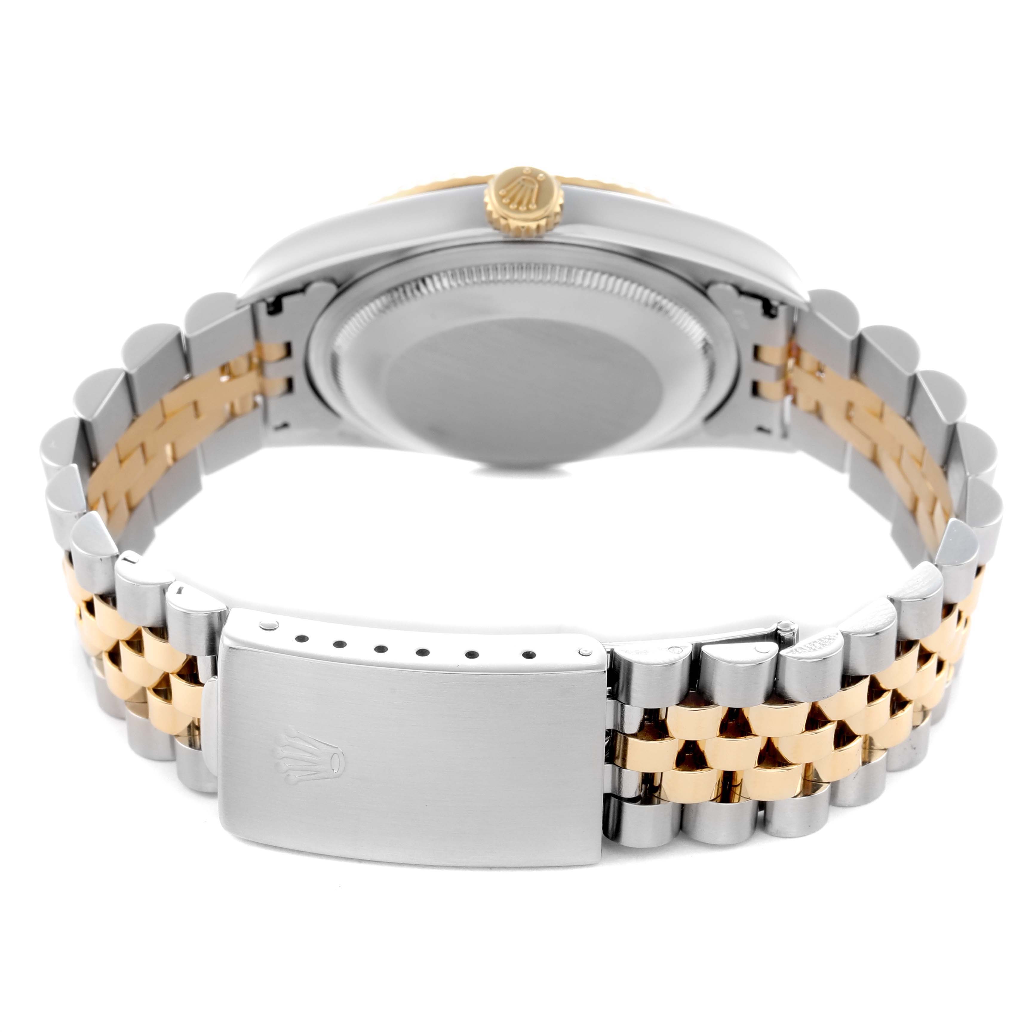 The image shows the back of a Rolex Datejust 16233 Men
s Steel and Gold (two tone) Yellow Dial 16233 Men
s Steel and Gold (two tone) Yellow Dial, highlighting the bracelet and clasp with a two-tone design.