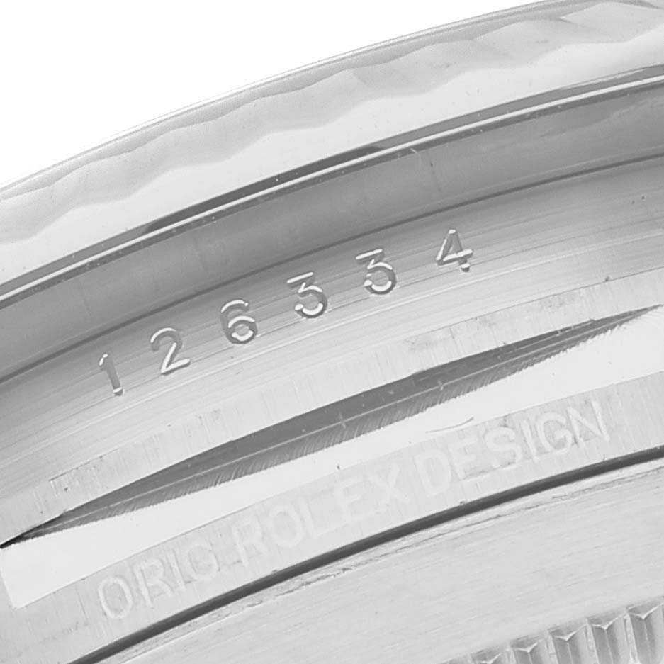 This close-up image shows the engraved serial number and "Orig Rolex Design" on the case of a Rolex Datejust 41 126334 Men's Stainless Steel White Dial 126334 Men's Stainless Steel White Dial model.