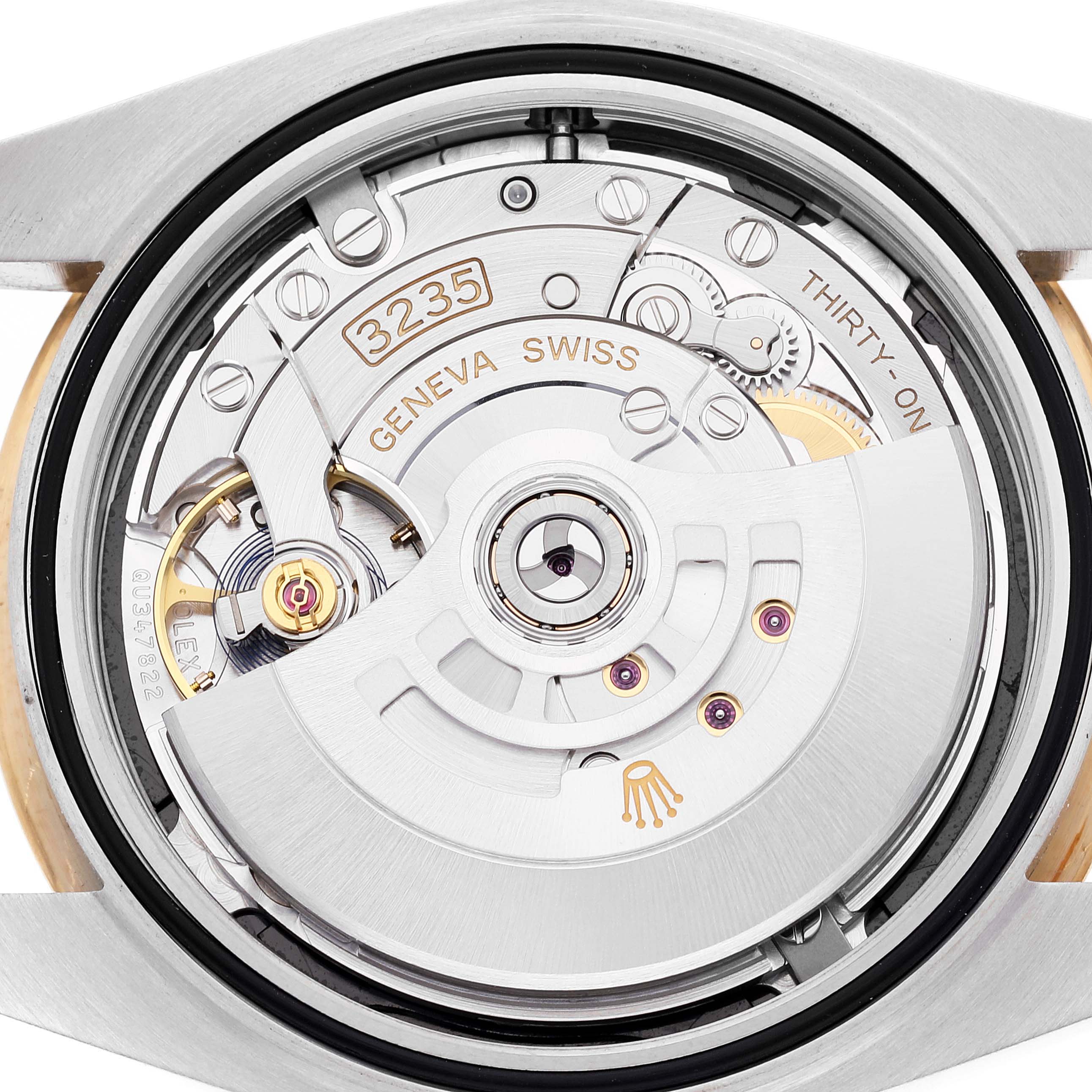 This image shows the movement mechanism from the back of a Rolex Datejust 41 126303 Men's Steel and Gold (two tone) Black Dial 126303 Men's Steel and Gold (two tone) Black Dial watch, highlighting the intricate interior parts.