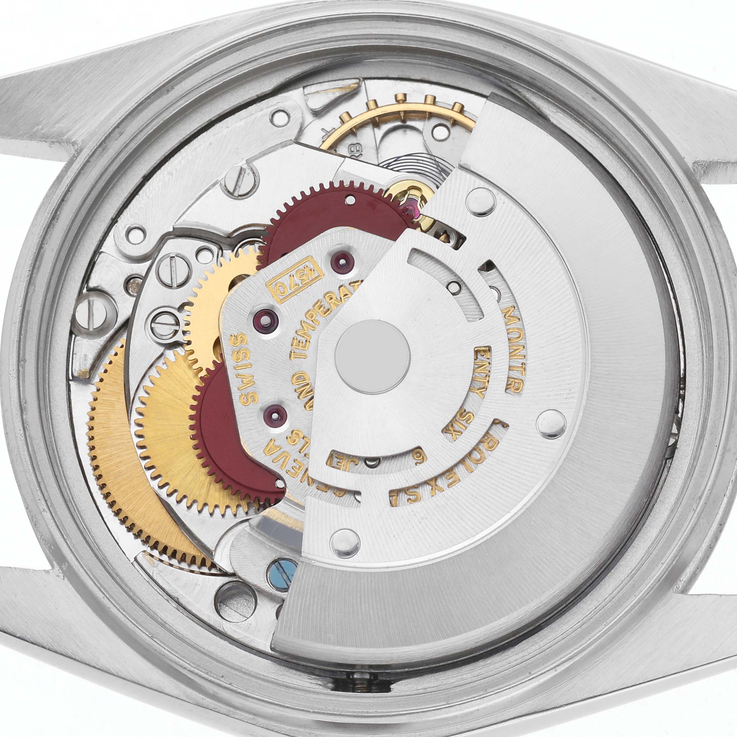 The image shows the movement of a Rolex Datejust 1603 Men
s Stainless Steel Silver Dial 1603 Men
s Stainless Steel Silver Dial from the back, highlighting gears and the rotor.