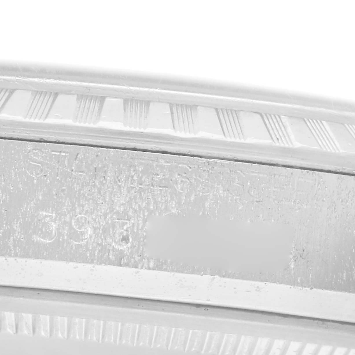 The image shows a close-up of the side of a Rolex Datejust 1603 Men
s Stainless Steel Silver Dial 1603 Men
s Stainless Steel Silver Dial watch, highlighting the engraved markings.