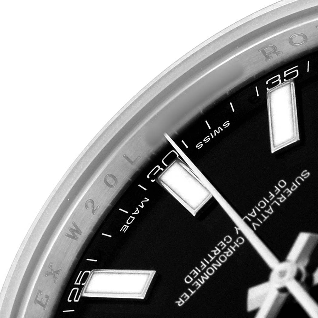 The image shows a close-up of the Rolex Datejust 41 116300 Men's Stainless Steel Black Dial dial, highlighting the markers, hands, and part of the bezel with engravings.