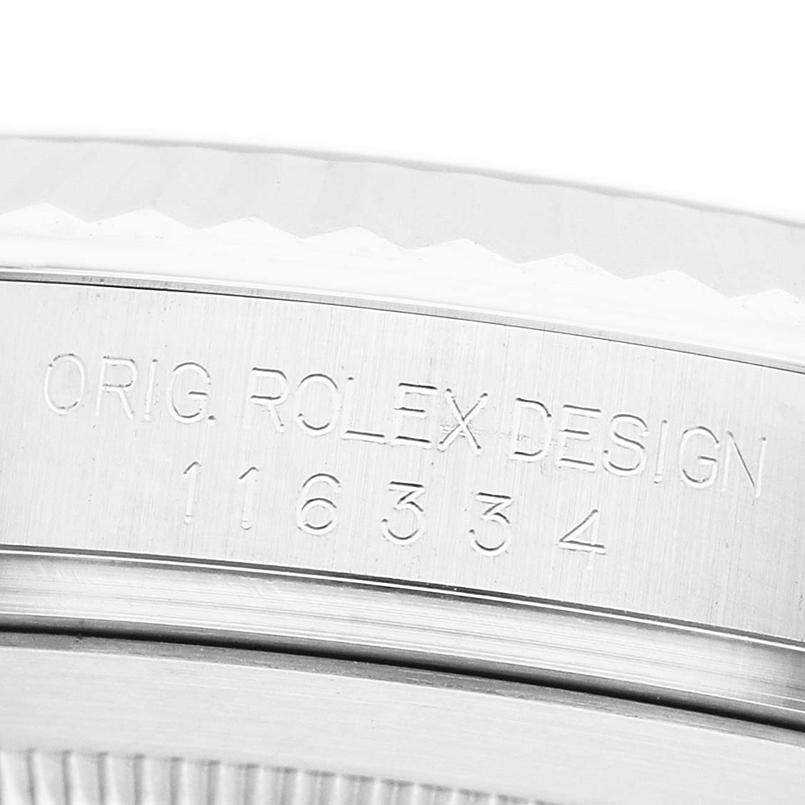 The image shows a close-up of the Rolex Datejust 41 116334 Men's Stainless Steel Grey Dial model's case edge, featuring engraved text.