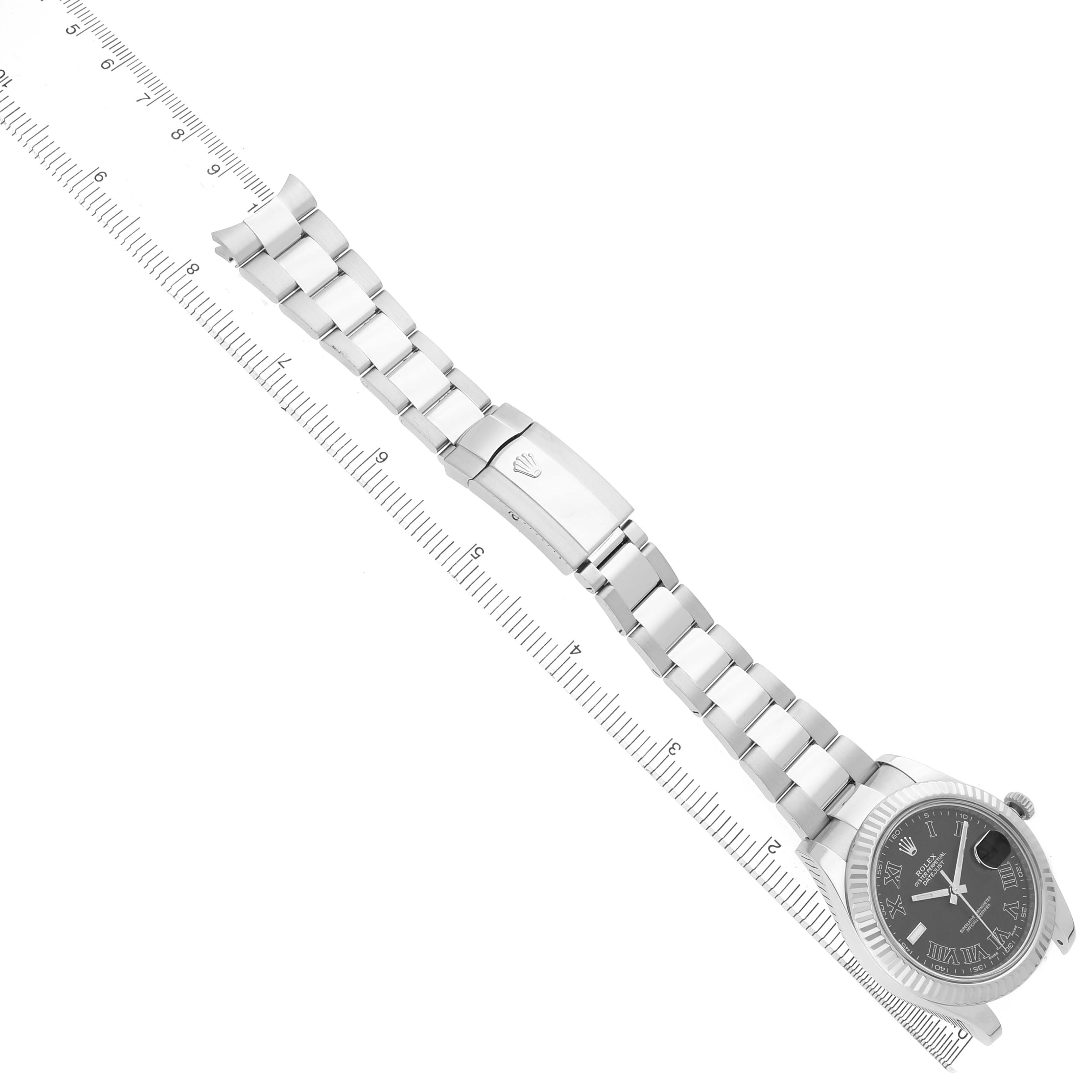 The Rolex Datejust 41 116334 Men's Stainless Steel Grey Dial is shown from a top-down angle, highlighting the bracelet, clasp, and watch face with a ruler beside it.