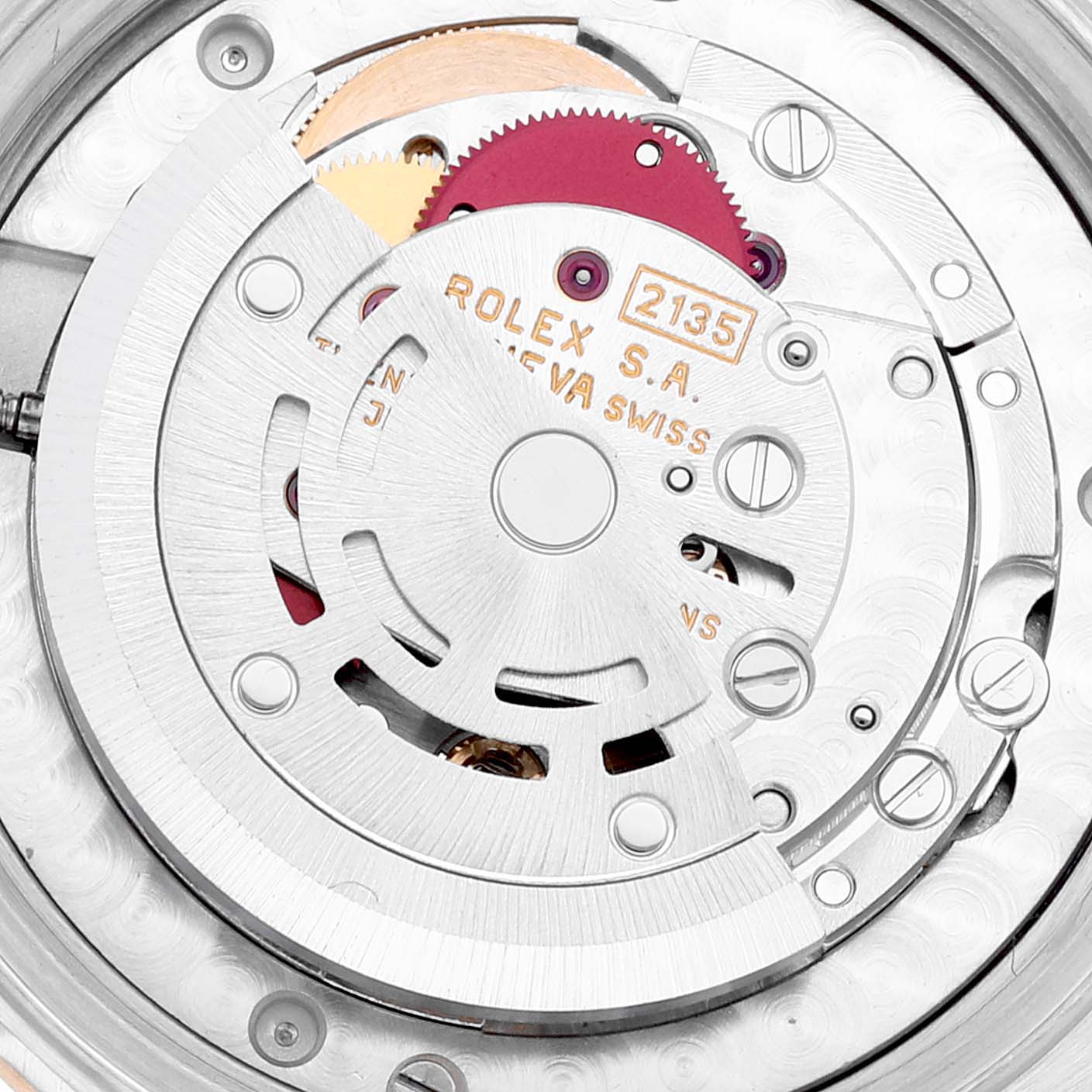 The image shows the inner mechanical movement mechanism of a Mid-Size Rolex watch, focusing on the caliber and engravings.