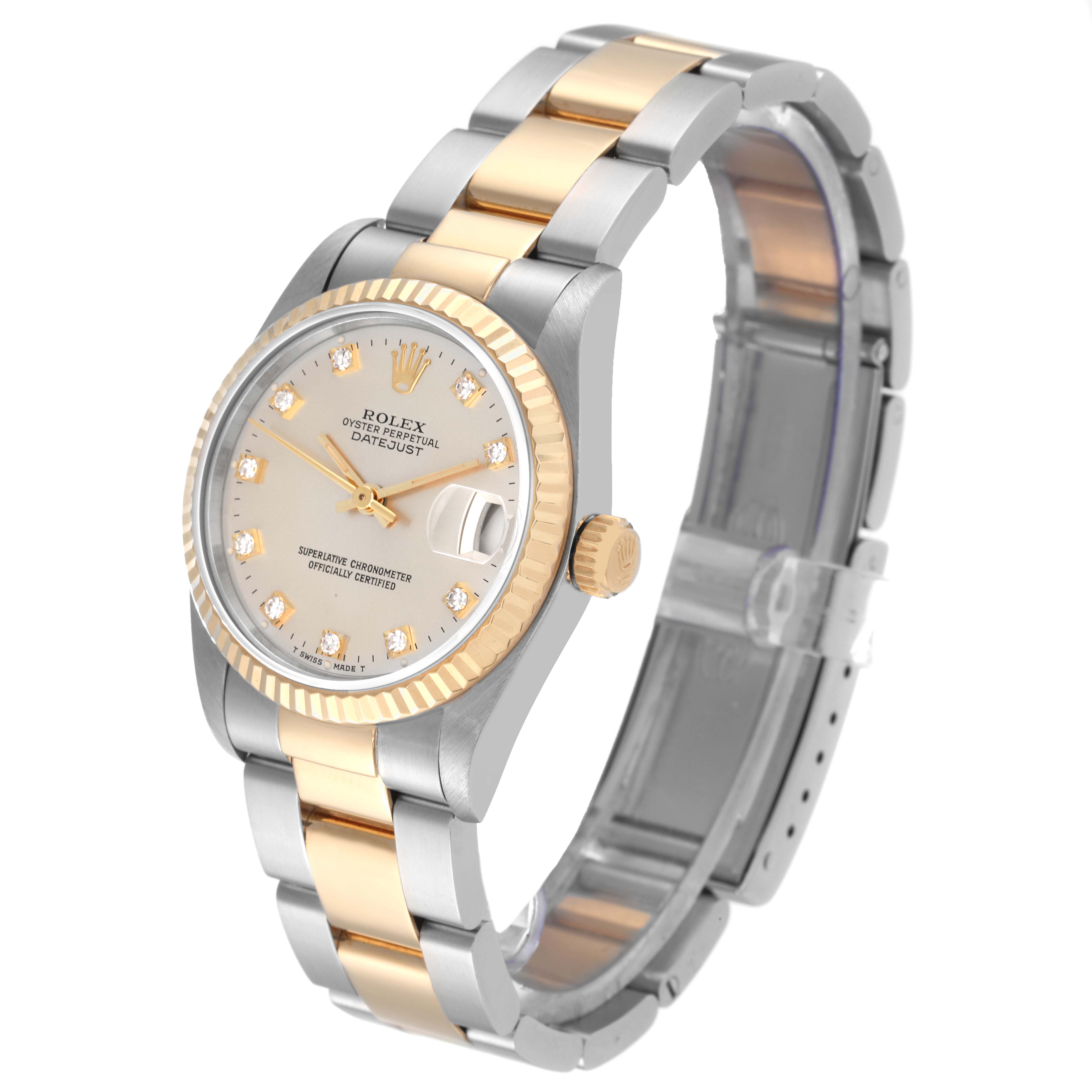 The image shows a Mid-Size Rolex Oyster Perpetual Datejust watch at a three-quarter angle, highlighting its face, bezel, and bracelet.