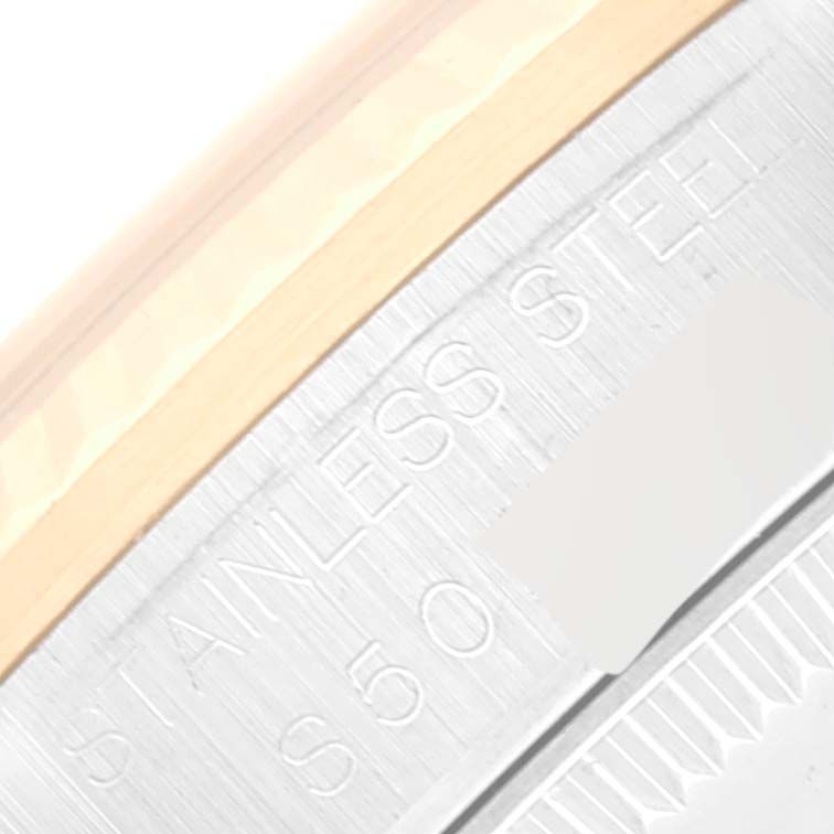 This image shows a close-up of the stainless steel part of a Rolex Mid-Size 68273 Women's Steel and Gold (two tone) Silver Dial 68273 Women's Steel and Gold (two tone) Silver Dial model watch, highlighting the engraved text.