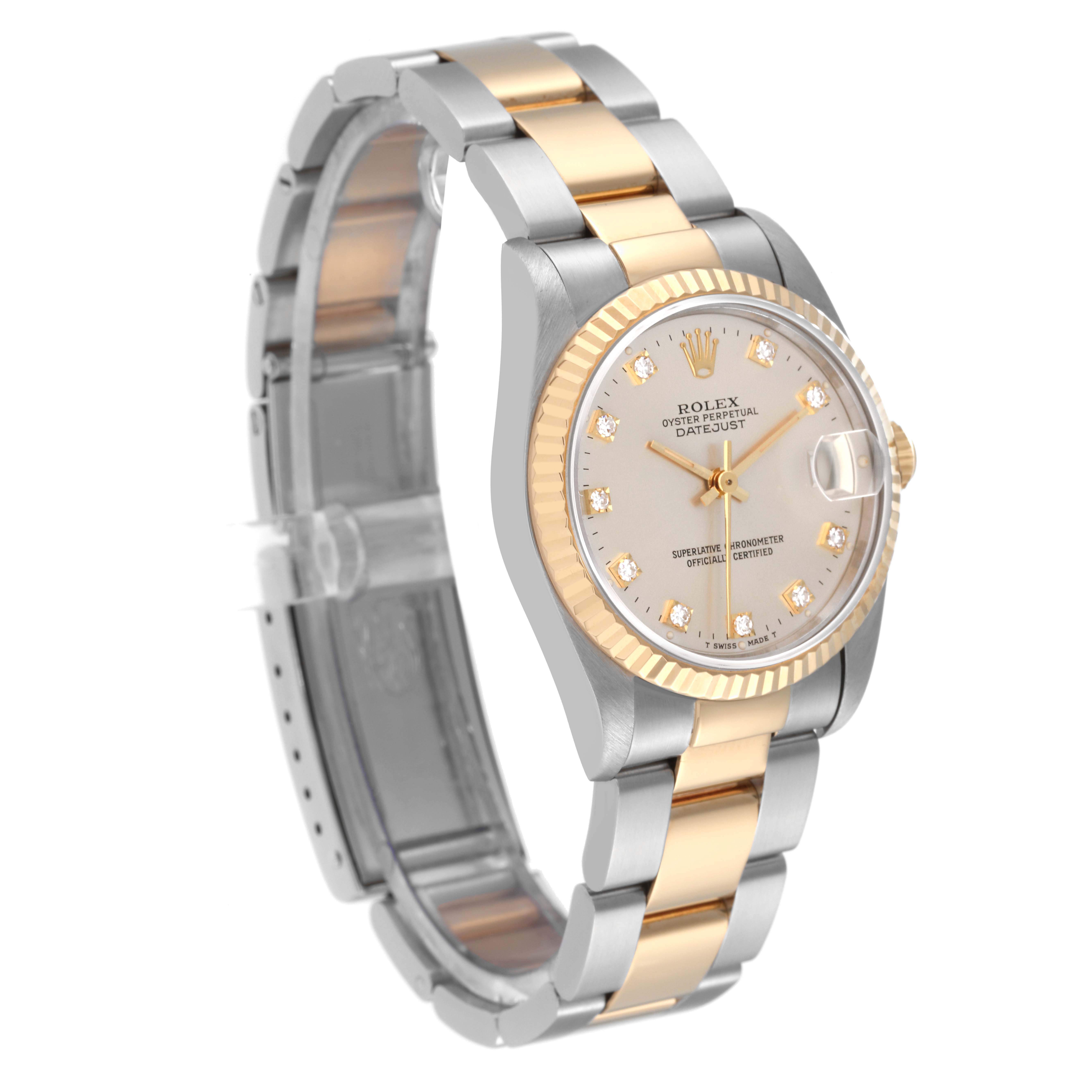 This image shows a Rolex Mid-Size 68273 Women's Steel and Gold (two tone) Silver Dial 68273 Women's Steel and Gold (two tone) Silver Dial Datejust watch at an angle displaying its face, bezel, and two-tone bracelet.