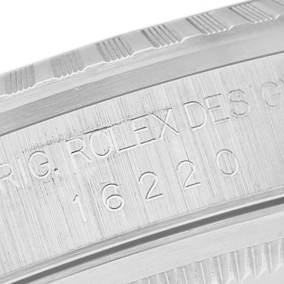 This close-up image shows the engraved model number and part of the bezel of a Rolex Datejust 16220 Men's Stainless Steel Silver Dial 16220 Men's Stainless Steel Silver Dial.