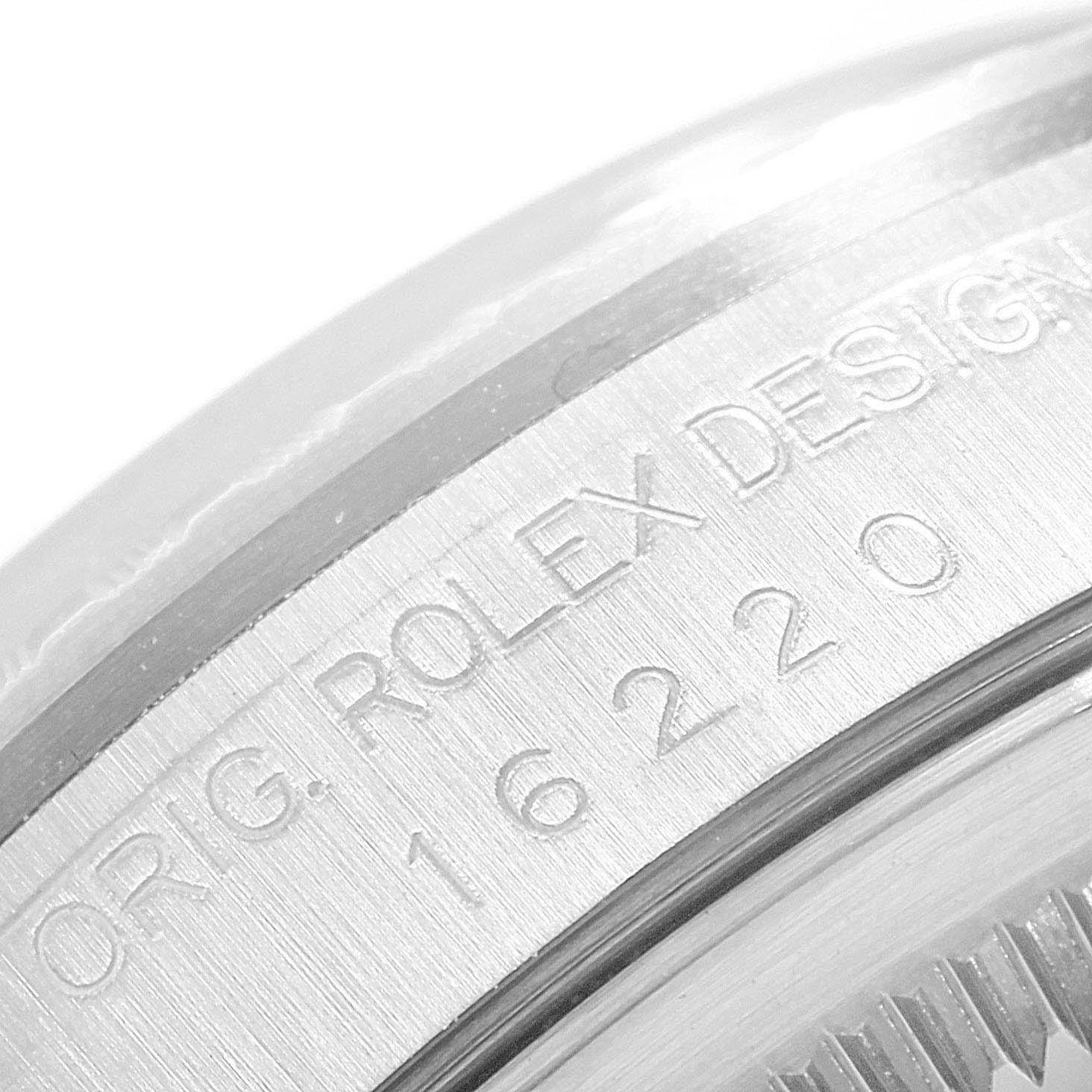 The image shows a close-up view of the engraved serial number and branding on the side of a Rolex Datejust 16220 Men's Stainless Steel Silver Dial 16220 Men's Stainless Steel Silver Dial watch.