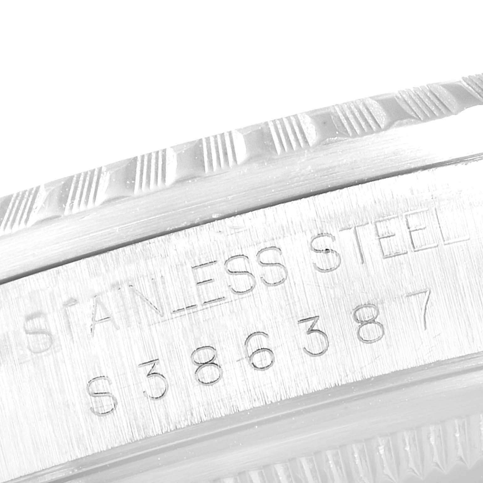 The image shows a close-up of the side view of the bezel and serial number on a Rolex Datejust 16220 Men's Stainless Steel Silver Dial 16220 Men's Stainless Steel Silver Dial watch.