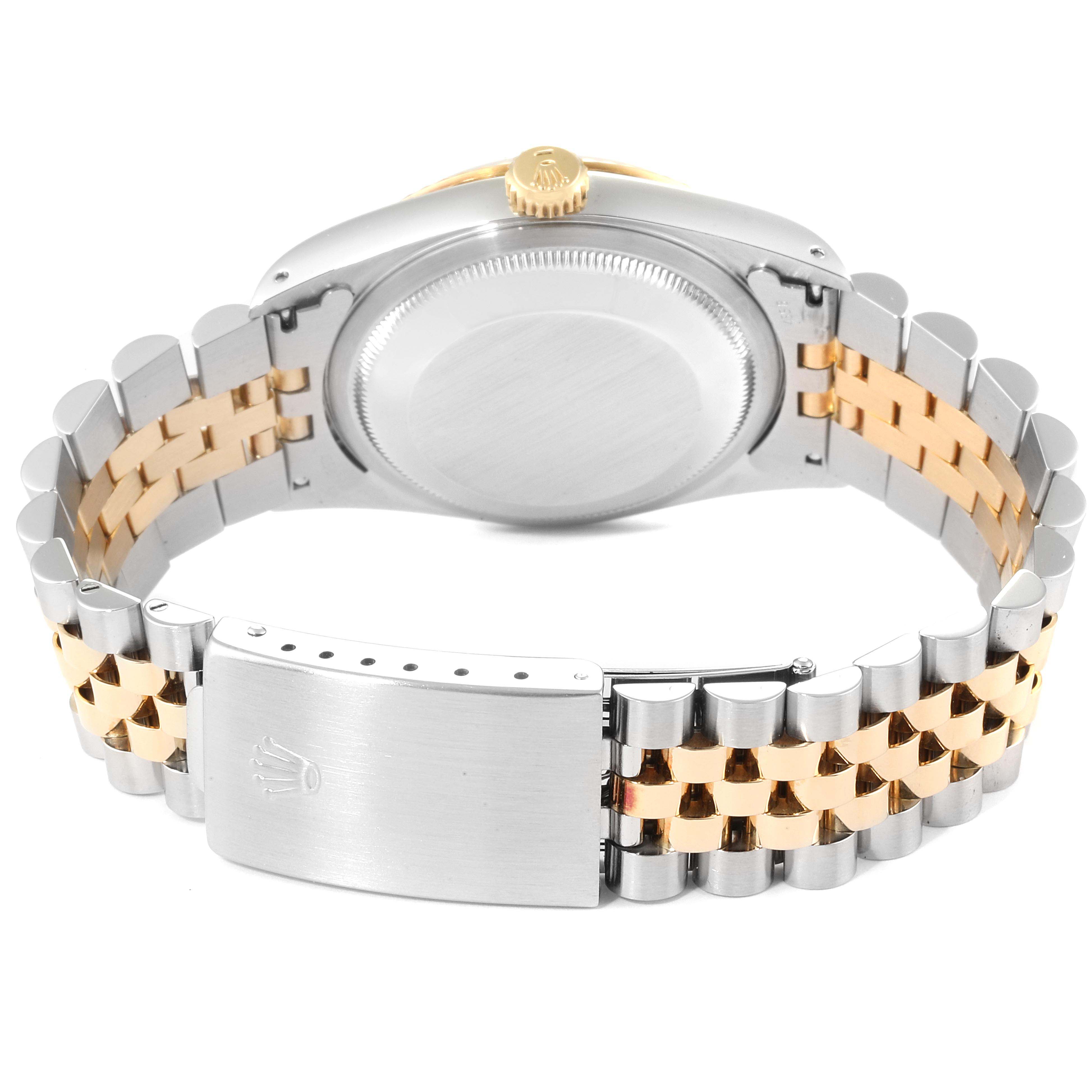 This image shows the back view of a Rolex Datejust 16233 Men
s Steel and Gold (two tone) Champagne Dial 16233 Men
s Steel and Gold (two tone) Champagne Dial watch, highlighting the case, crown, and Jubilee bracelet with the clasp.