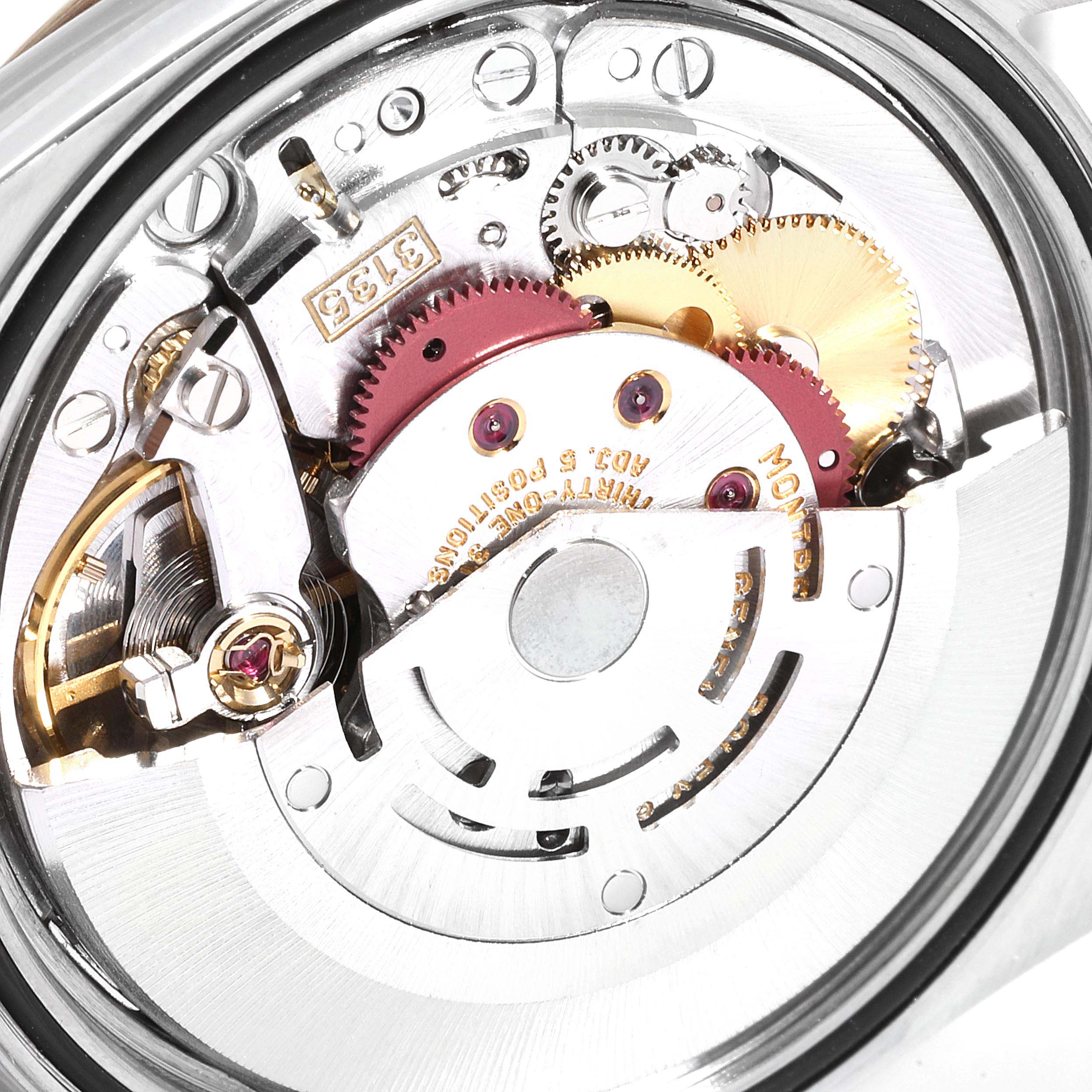 The image shows the movement mechanism of a Rolex Datejust 16233 Men
s Steel and Gold (two tone) Champagne Dial 16233 Men
s Steel and Gold (two tone) Champagne Dial watch from a close-up, rear view angle.