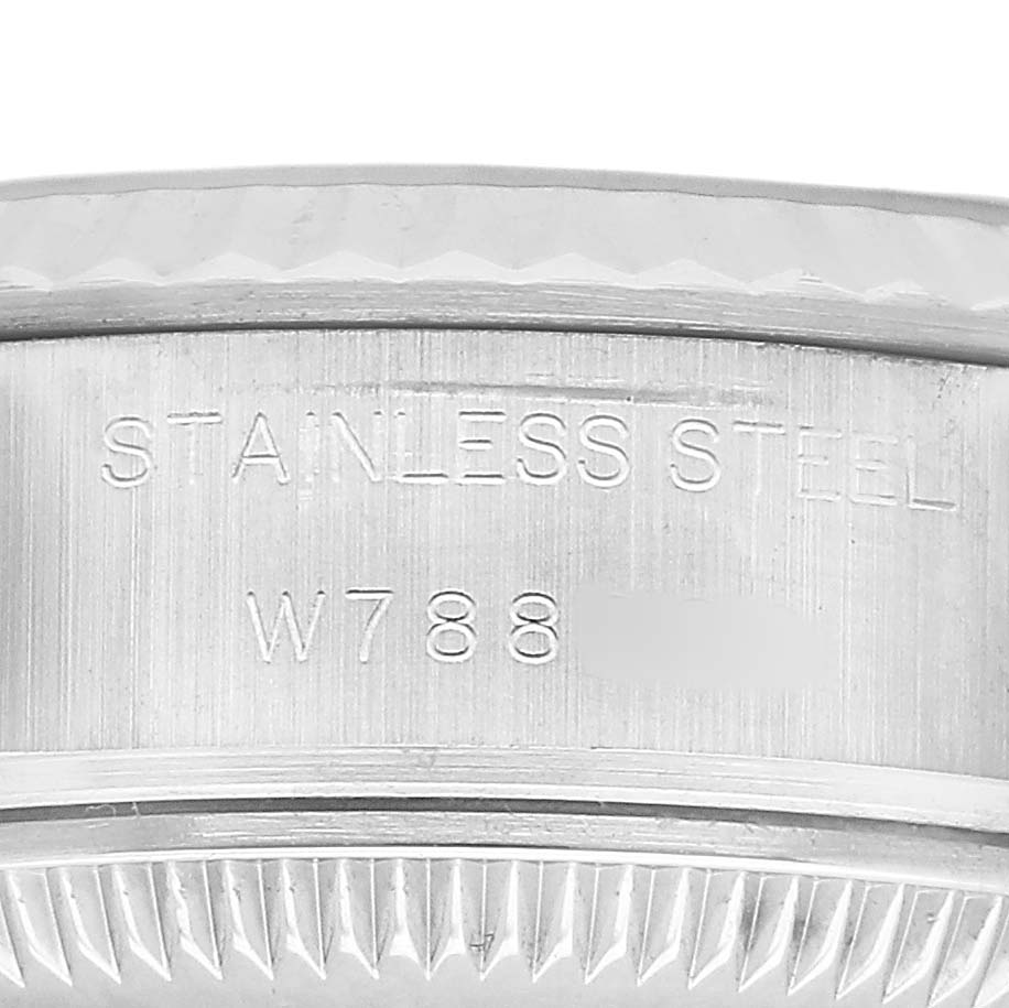 The image shows a close-up of the side view of a Rolex Datejust 69174 Women's Stainless Steel Black Dial watch case, highlighting the stainless steel engraving.
