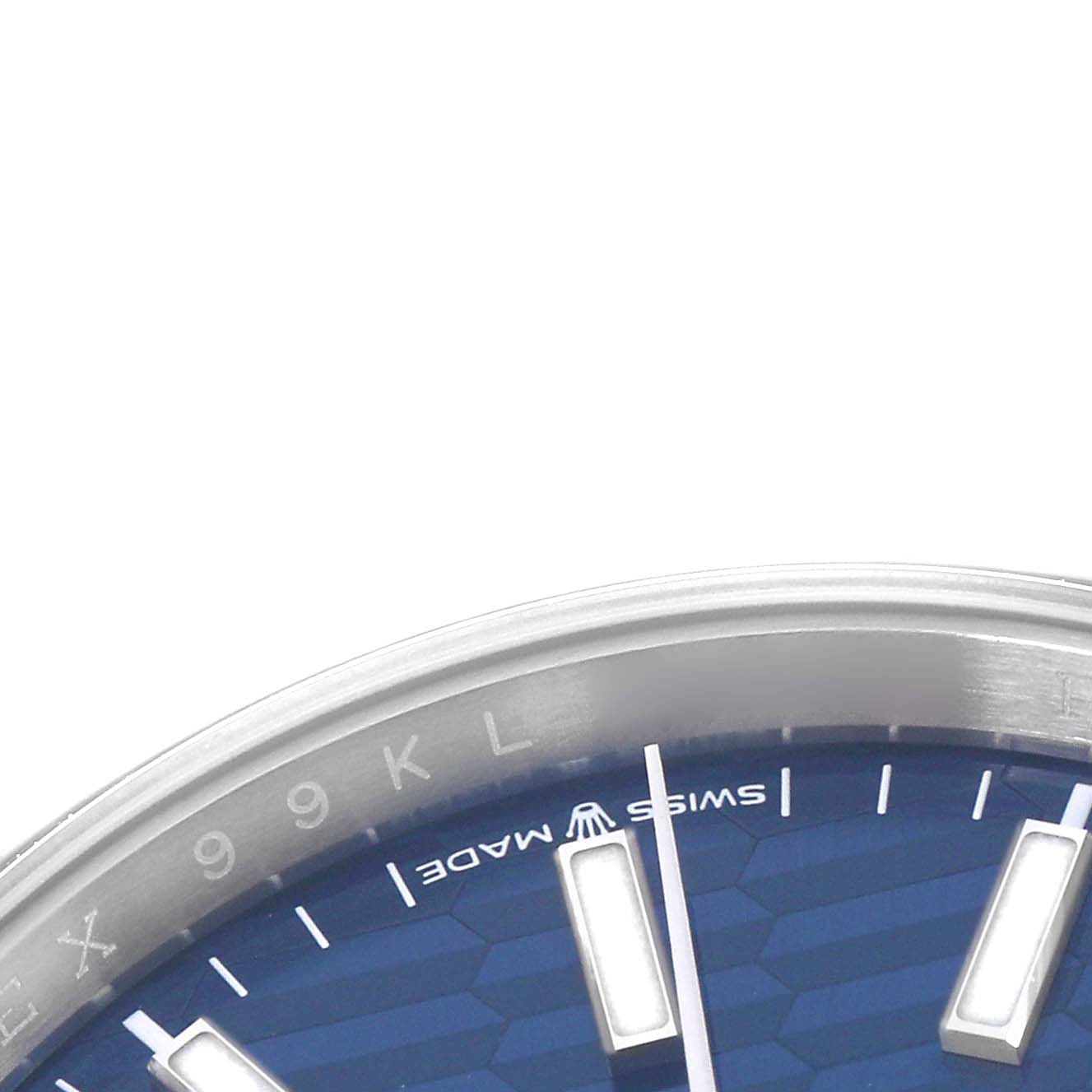 The image shows a close-up of a Rolex Datejust 126234 Men
s Stainless Steel Blue Dial 126234 Men
s Stainless Steel Blue Dial watch
s upper dial section, highlighting the bezel, index markers, and logo.