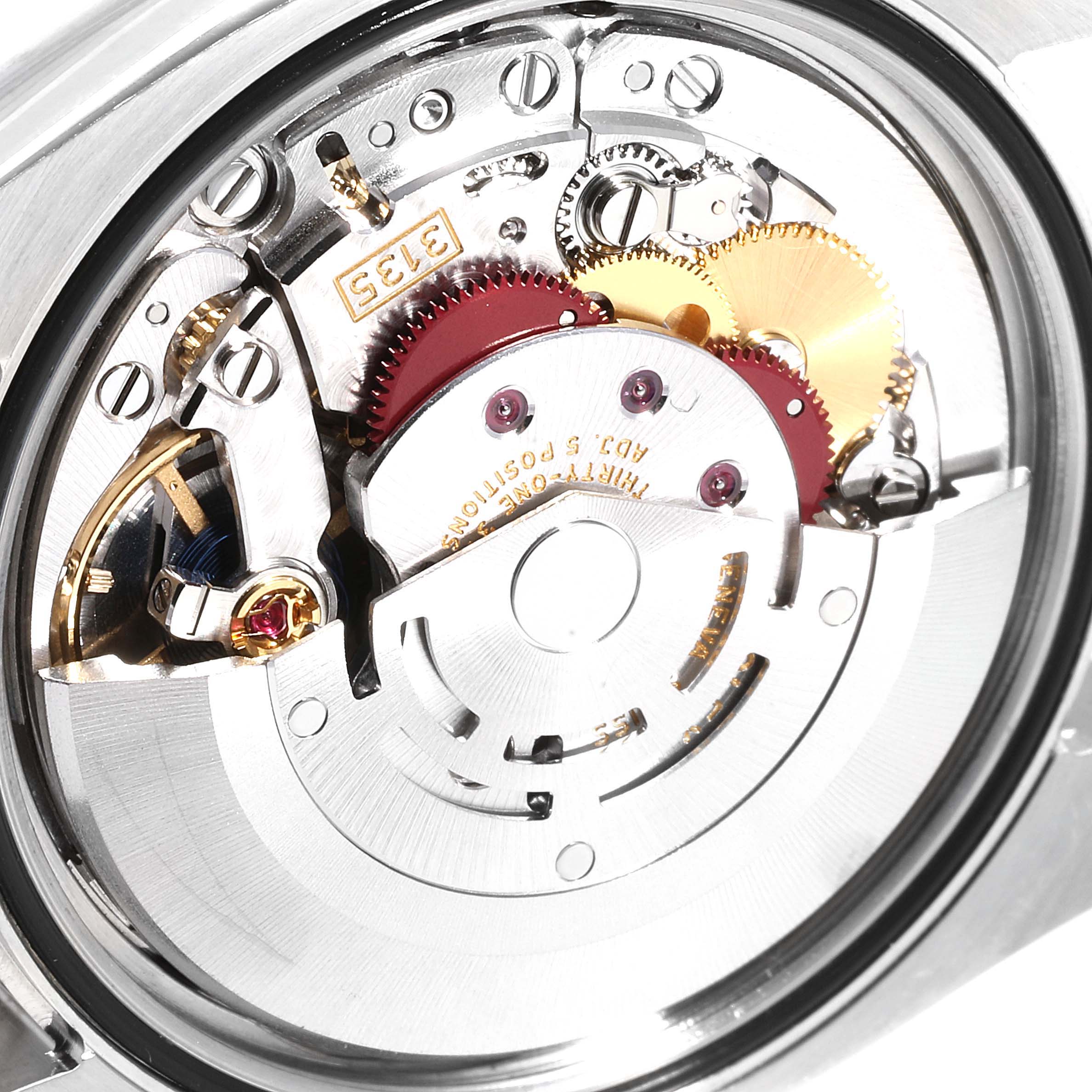 The image shows the movement mechanism of a Rolex Datejust 116234 Men's Stainless Steel White Dial 116234 Men's Stainless Steel White Dial watch from a close-up rear angle.