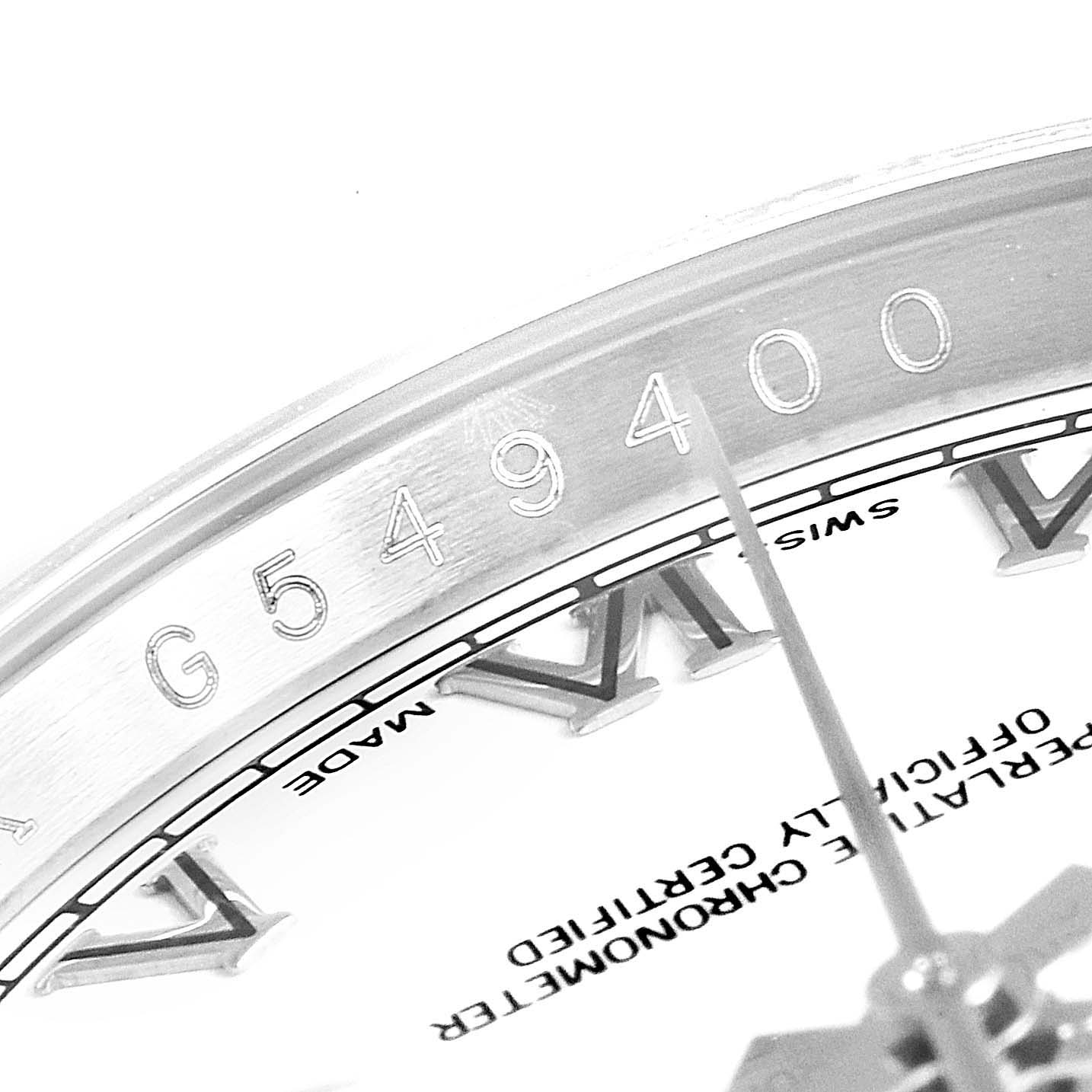 This image shows a close-up of the serial number and part of the dial on the Rolex Datejust 116234 Men's Stainless Steel White Dial 116234 Men's Stainless Steel White Dial watch.