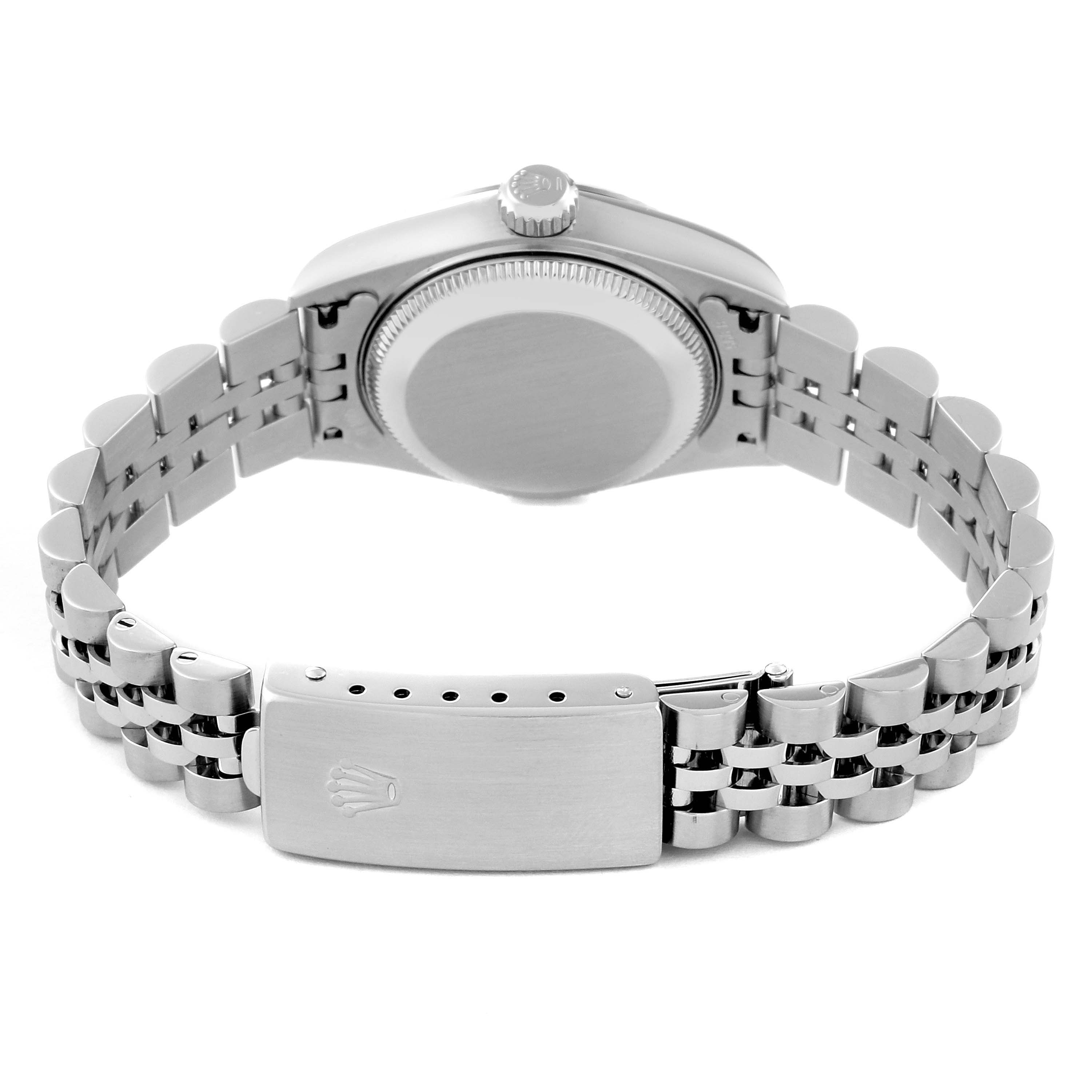 The image shows the back of the Rolex Datejust 79174 Women
s Stainless Steel Mother of Pearl Dial 79174 Women
s Stainless Steel Mother of Pearl Dial watch, including the caseback, crown, and Jubilee bracelet with the clasp.