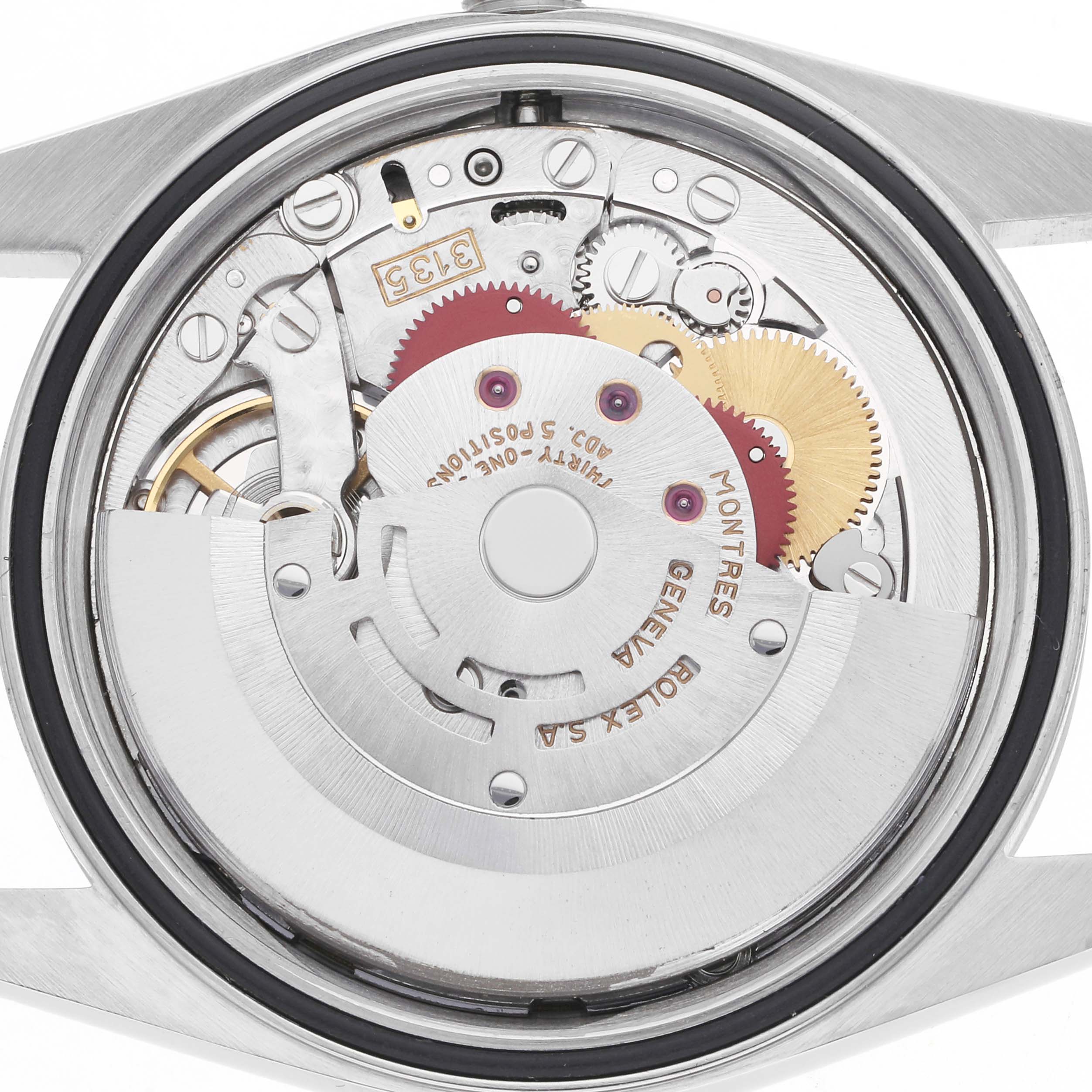 The image shows the back view of a Rolex Datejust 16234 Men
s Stainless Steel White Dial 16234 Men
s Stainless Steel White Dial, highlighting its intricate movement components.