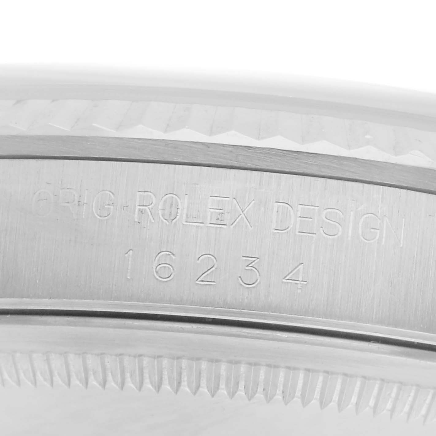 The image shows a close-up of the Rolex Datejust 16234 Men
s Stainless Steel White Dial 16234 Men
s Stainless Steel White Dial model
s side case with engraved model number 16234.