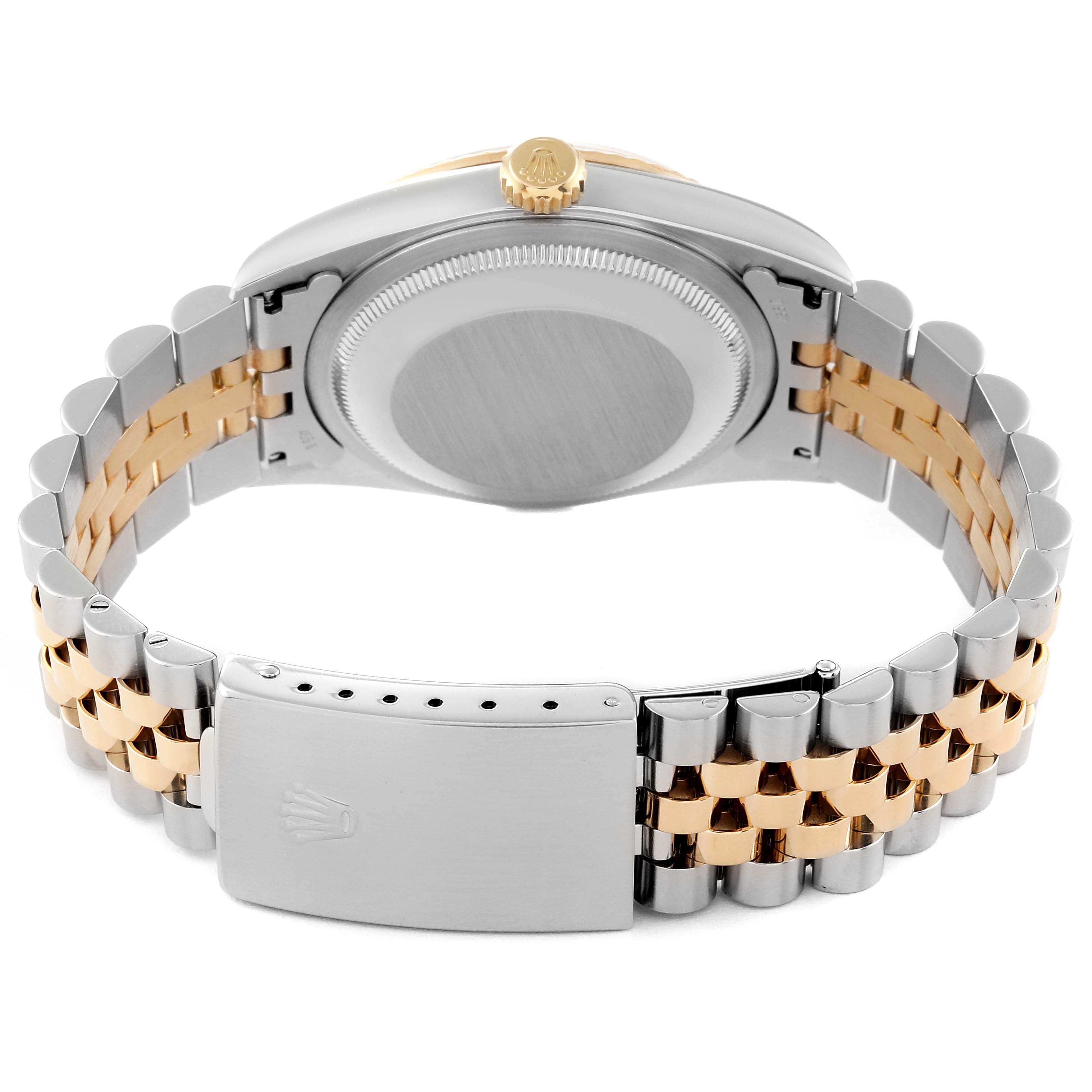 The image shows the back view of a Rolex Datejust 16233 Men's Steel and Gold (two tone) Champagne Dial 16233 Men's Steel and Gold (two tone) Champagne Dial watch, highlighting its caseback, crown, and two-tone bracelet with clasp.