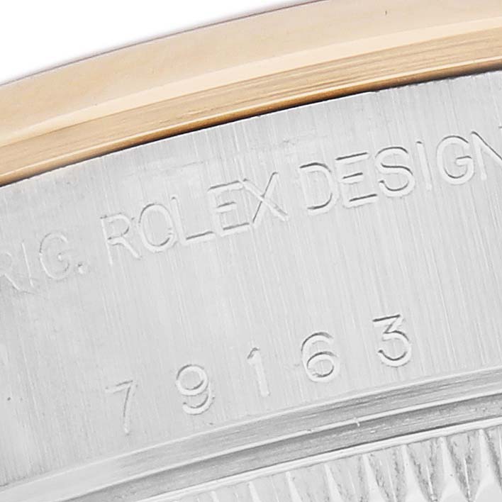 The image shows a close-up of the engraved case back of a Rolex Datejust 79163 Women
s Steel and Gold (two tone) Mother of Pearl Dial 79163 Women
s Steel and Gold (two tone) Mother of Pearl Dial watch, highlighting the model number.