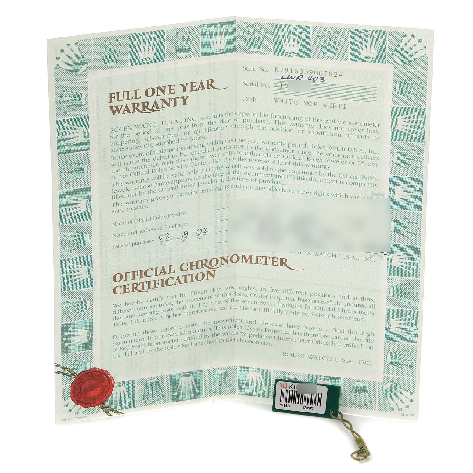 The image shows a Rolex Datejust 79163 Women
s Steel and Gold (two tone) Mother of Pearl Dial 79163 Women
s Steel and Gold (two tone) Mother of Pearl Dial watch warranty card and chronometer certification held upright, displaying text and logos.