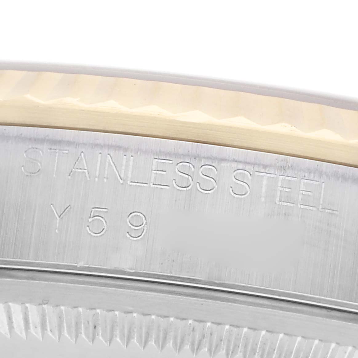 The image shows a close-up of the side of a Rolex Datejust 16233 Men
s Steel and Gold (two tone) Silver Dial 16233 Men
s Steel and Gold (two tone) Silver Dial, featuring the engraved stainless steel part and bezel.