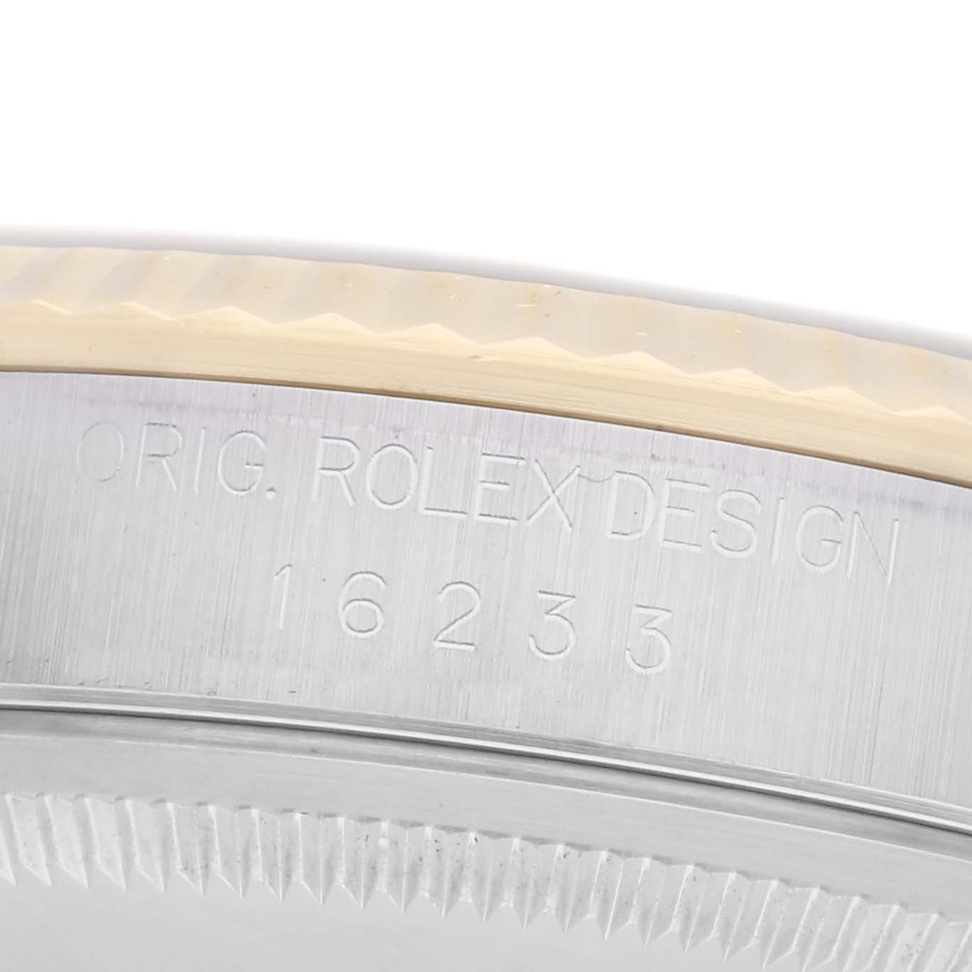 The image shows a close-up of the engraved case side of a Rolex Datejust 16233 Men
s Steel and Gold (two tone) Silver Dial 16233 Men
s Steel and Gold (two tone) Silver Dial, featuring the model number 16233.