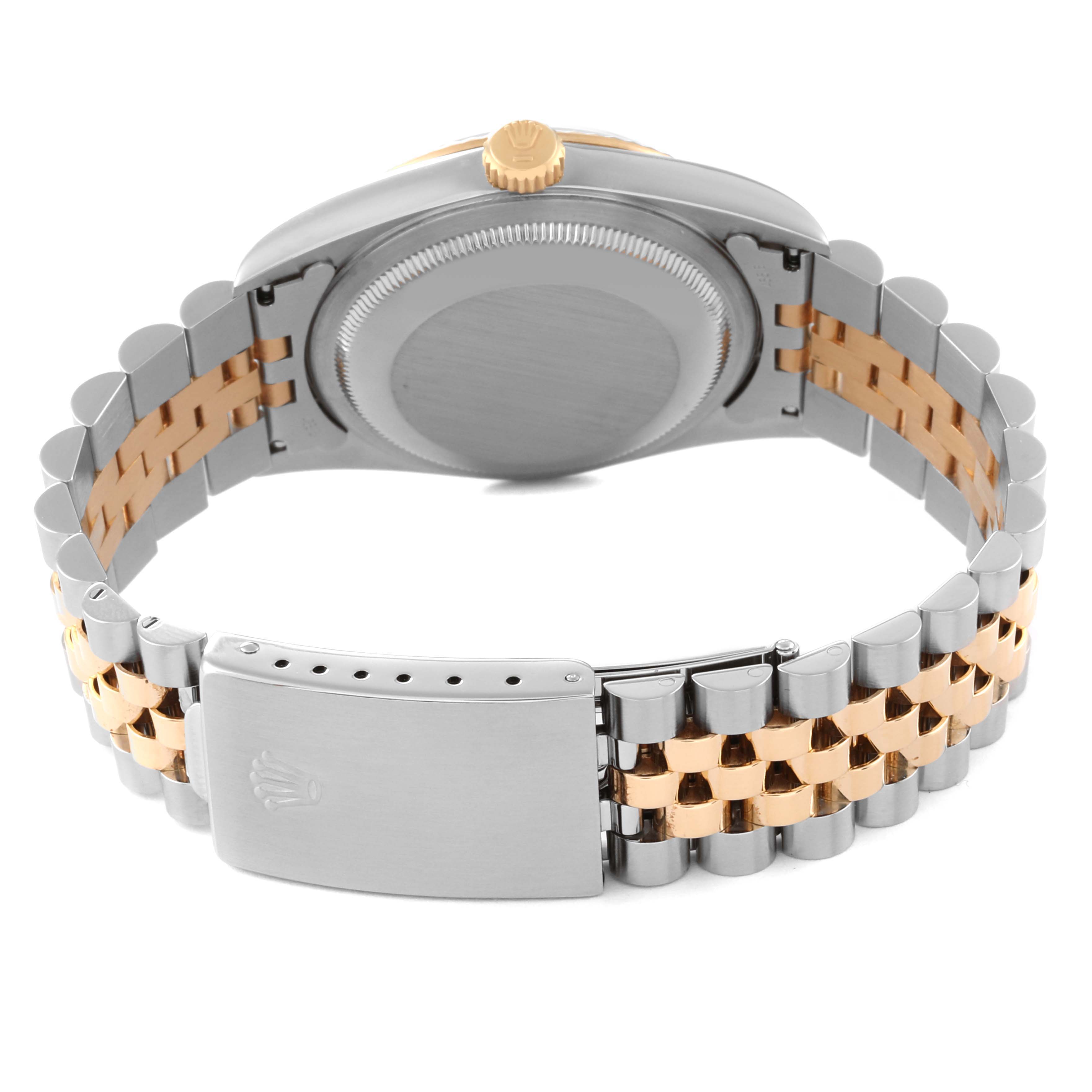 The image shows the rear view of a Rolex Datejust 16233 Men's Steel and Gold (two tone) Grey Dial 16233 Men's Steel and Gold (two tone) Grey Dial, highlighting its clasp, bracelet, and case back.