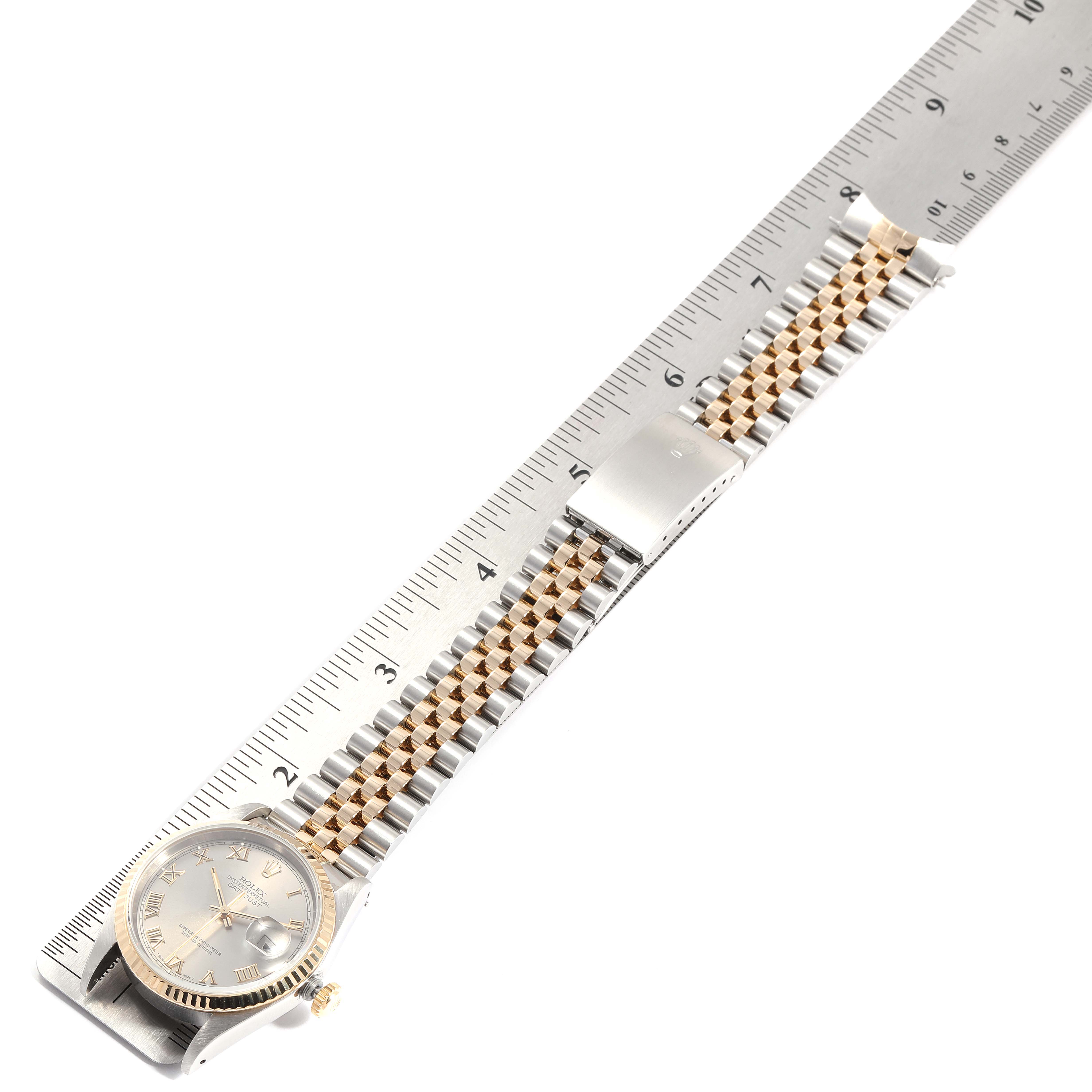 The image shows a Rolex Datejust 16233 Men
s Steel and Gold (two tone) Grey Dial 16233 Men
s Steel and Gold (two tone) Grey Dial watch with a ruler, capturing the dial, bracelet, clasp, and crown.