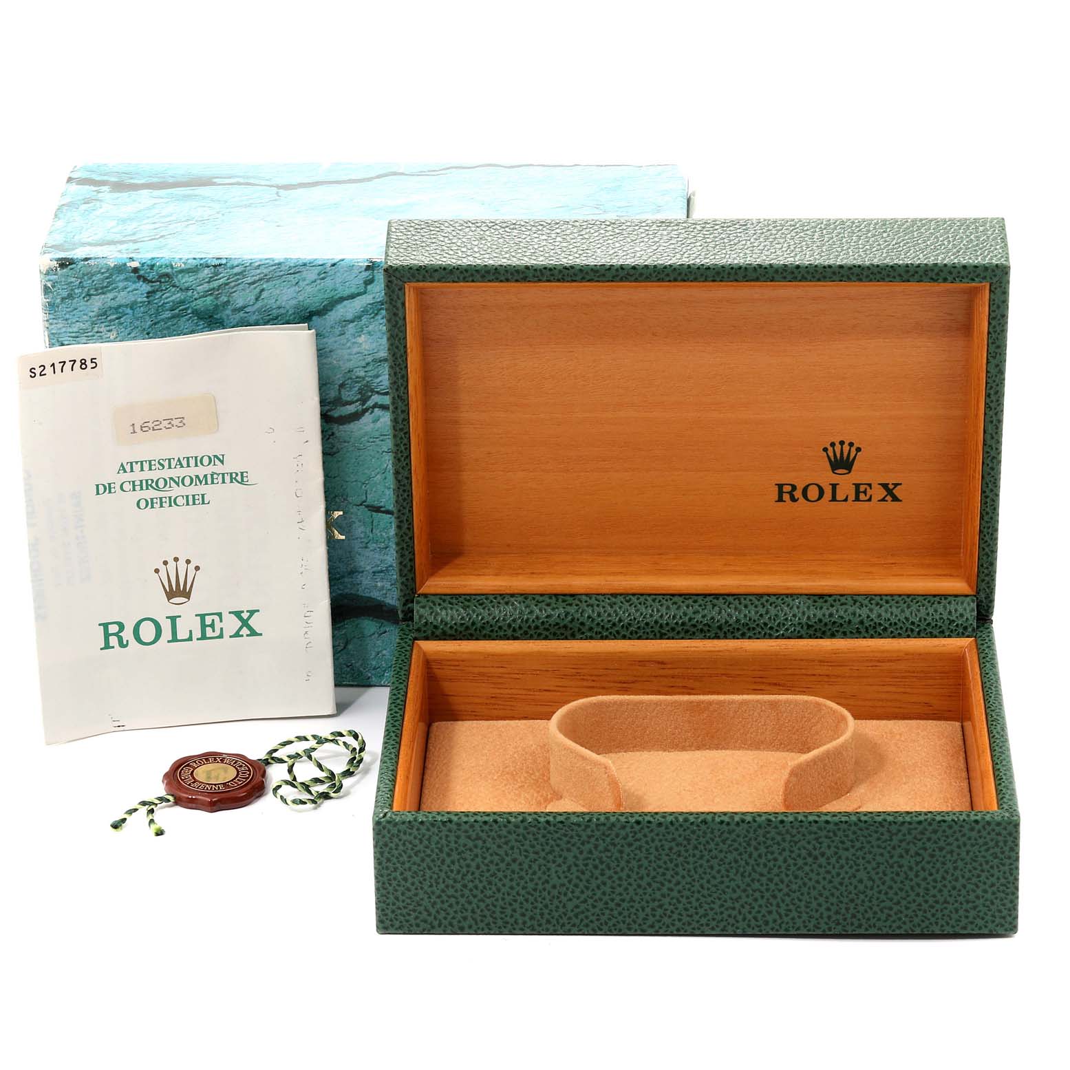 The image shows an open green Rolex box for the Datejust model with accompanying booklet and tag accessories.