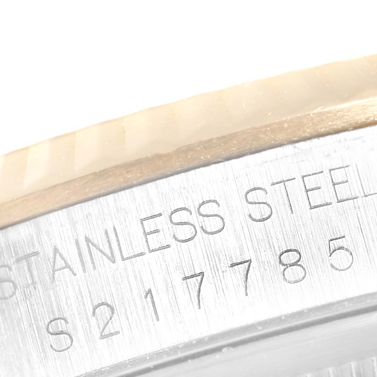 This close-up image shows the engraving on the stainless steel back case of a Rolex Datejust 16233 Men
s Steel and Gold (two tone) Grey Dial 16233 Men
s Steel and Gold (two tone) Grey Dial watch.