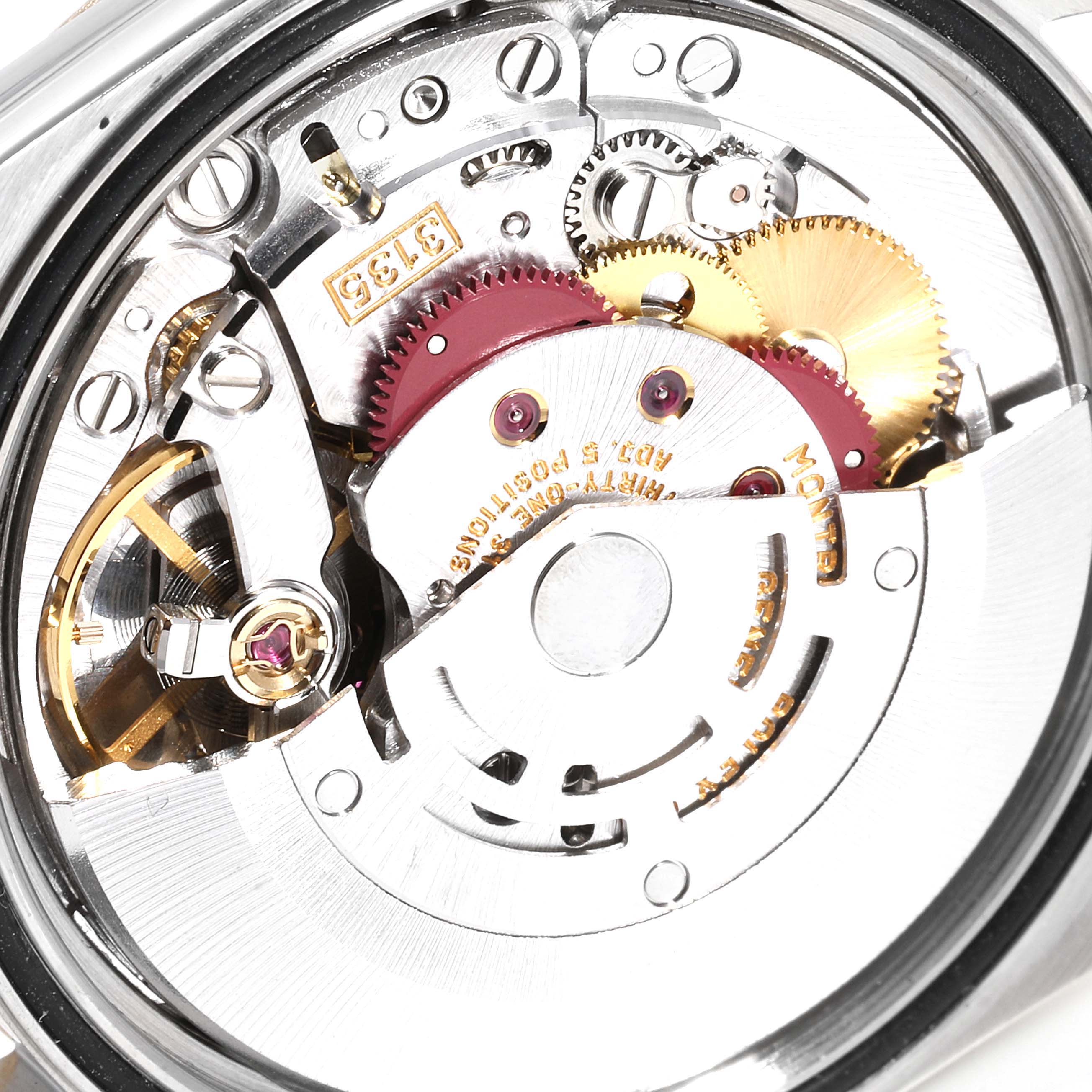 A close-up view of the movement mechanism in a Rolex Datejust 16233 Men
s Steel and Gold (two tone) Grey Dial 16233 Men
s Steel and Gold (two tone) Grey Dial watch, showing gears and intricate components.