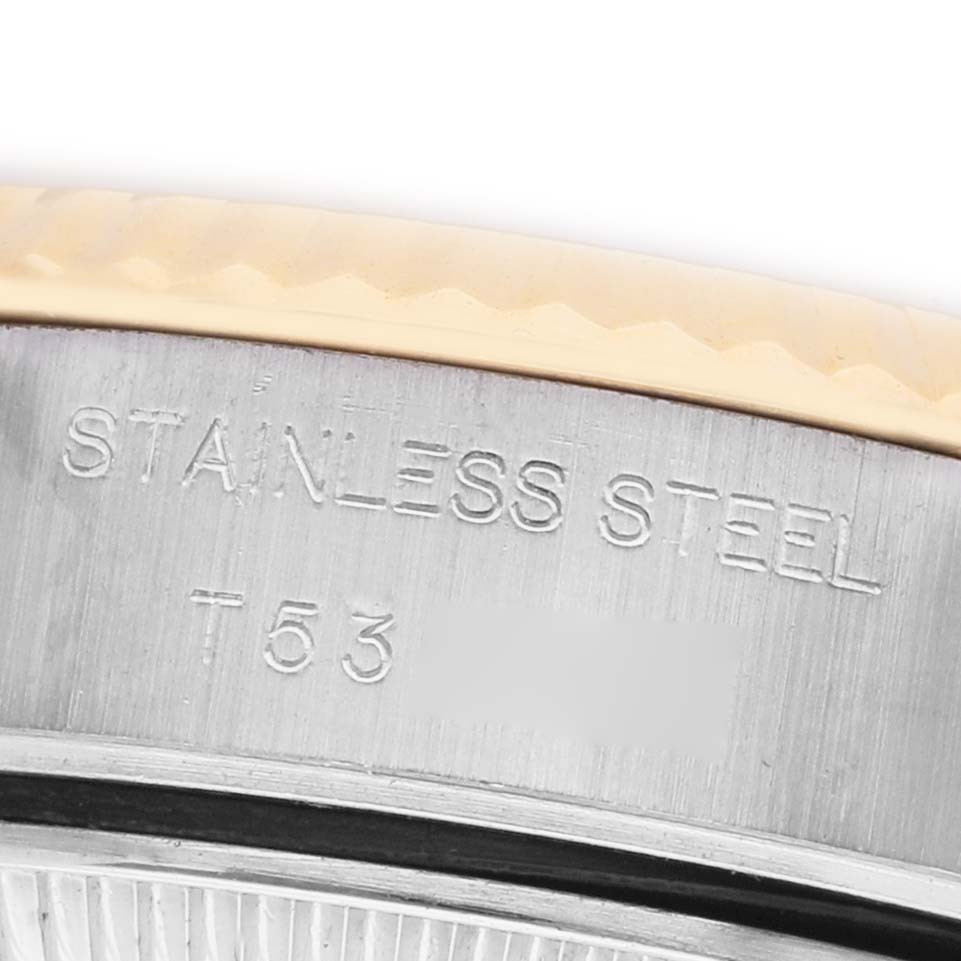 The image shows a close-up of the side of a Rolex Datejust 69173 Women's Steel and Gold (two tone) White Dial, highlighting the stainless steel marking.