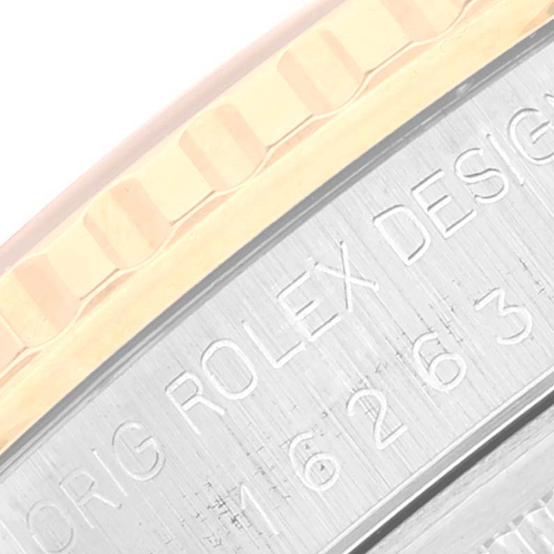 This close-up angle of a Rolex Turn-o-Graph 16263 Men's Steel and Gold (two tone) Champagne Dial 16263 Men's Steel and Gold (two tone) Champagne Dial watch shows part of the bezel and the engraved case side.