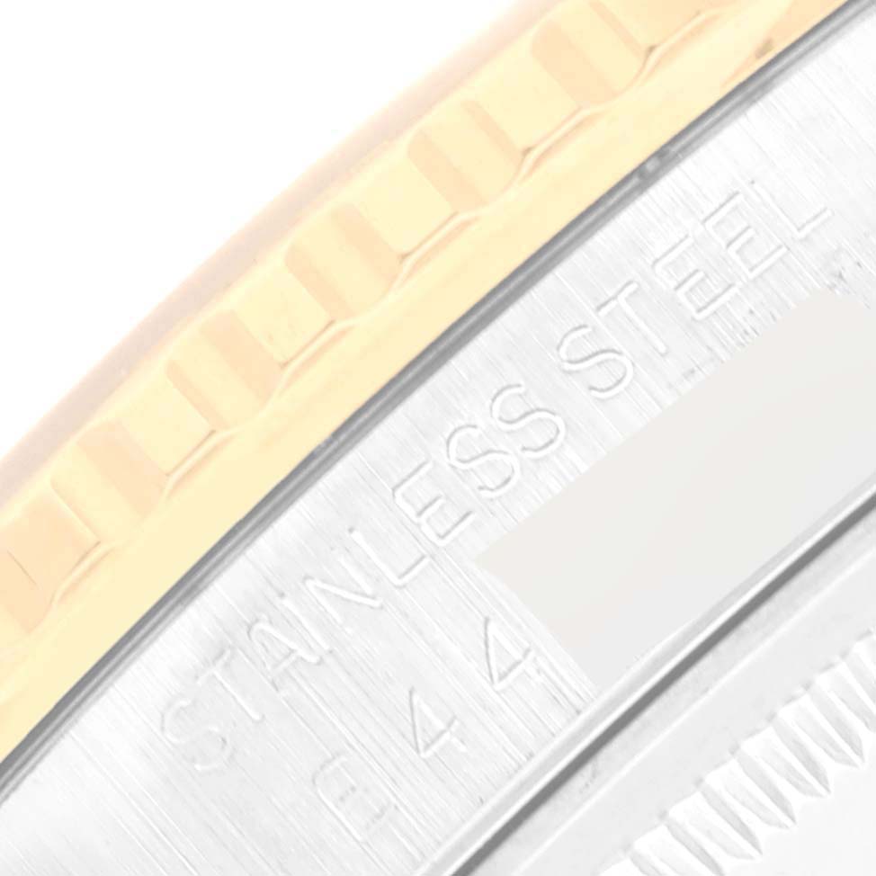 This image shows a close-up angle of the bezel and part of the case with "STAINLESS STEEL" engraved on a Rolex Turn-o-Graph 16263 Men's Steel and Gold (two tone) Champagne Dial 16263 Men's Steel and Gold (two tone) Champagne Dial watch.