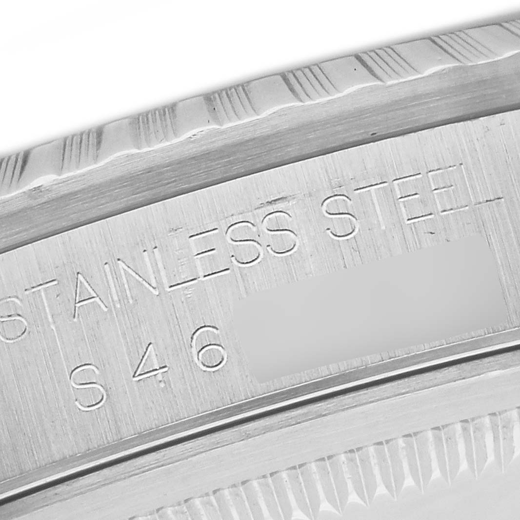 A close-up view of the case side engraving of a Rolex Datejust 16220 Men
s Stainless Steel White Dial 16220 Men
s Stainless Steel White Dial, showing the word "STAINLESS STEEL" and fluted bezel details.
