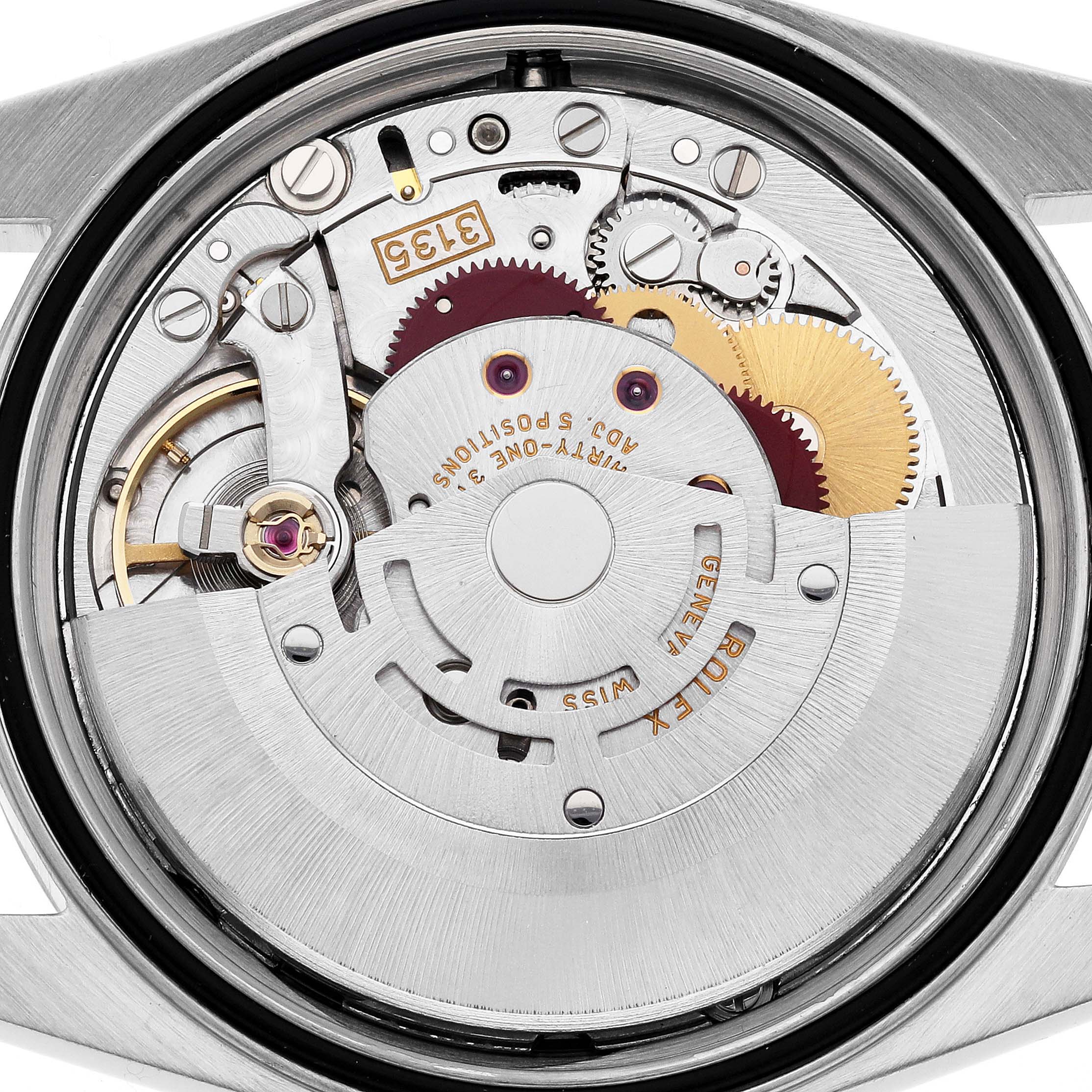 The image shows a close-up view of the movement and internal mechanism of a Rolex Datejust 16220 Men
s Stainless Steel White Dial 16220 Men
s Stainless Steel White Dial watch.