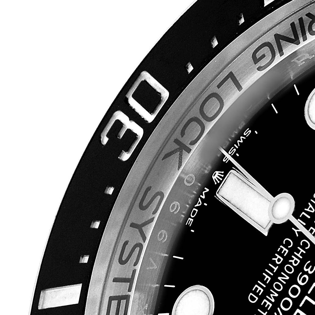 The image shows a close-up of the bezel, part of the dial, and hands of the Rolex Sea-Dweller 136660 Men's Stainless Steel Blue Dial watch at an angle.