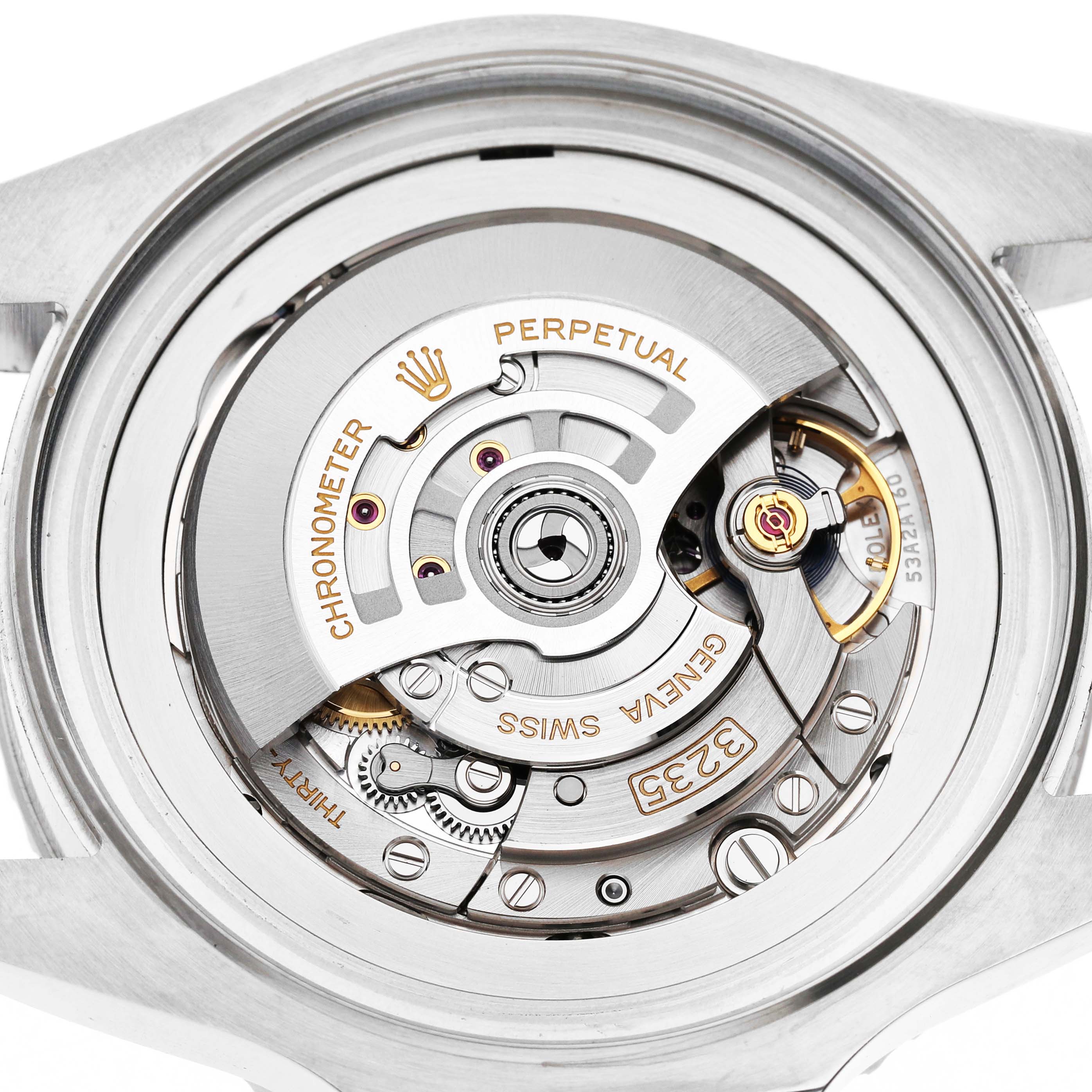 The image shows the movement of the Rolex Sea-Dweller 136660 Men's Stainless Steel Blue Dial watch from a rear angle, highlighting its intricate mechanical components.